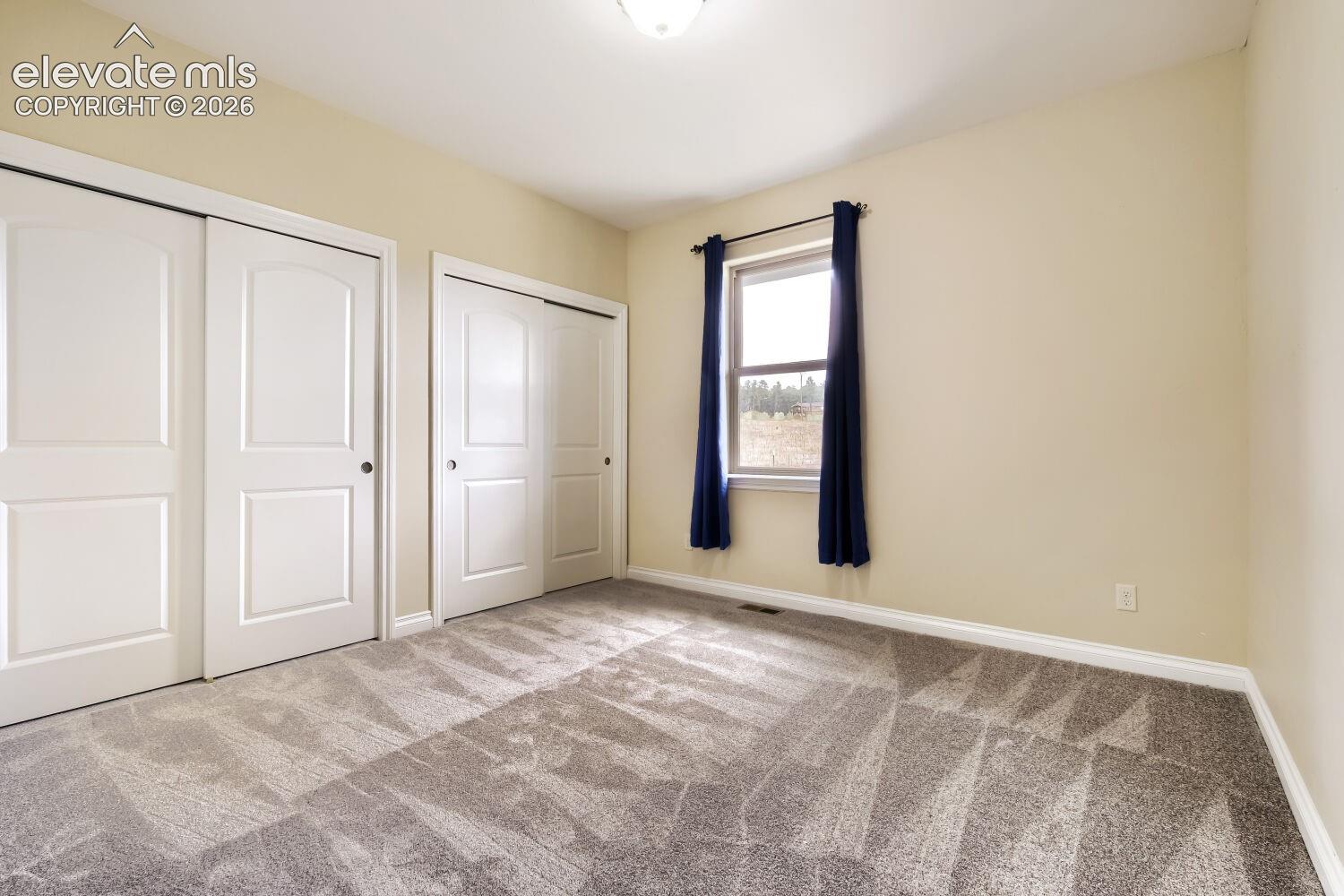 Second of three main floor bedrooms and office.