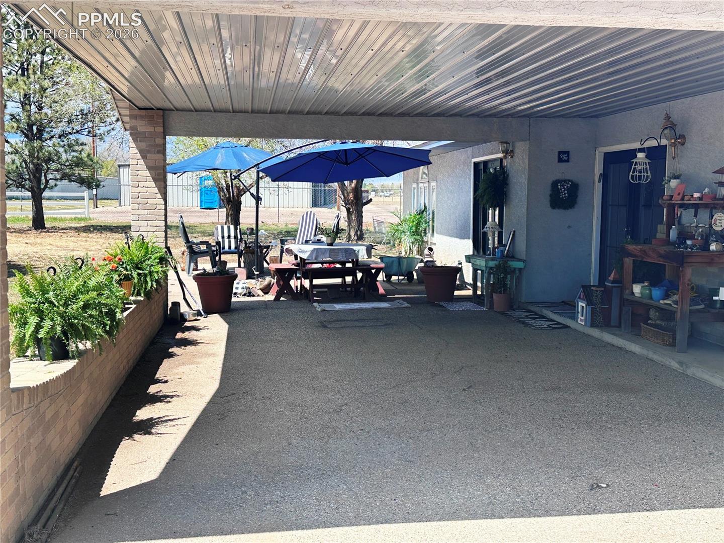 Covered drive-under entry for loading or unloading, or handicap easy entry.