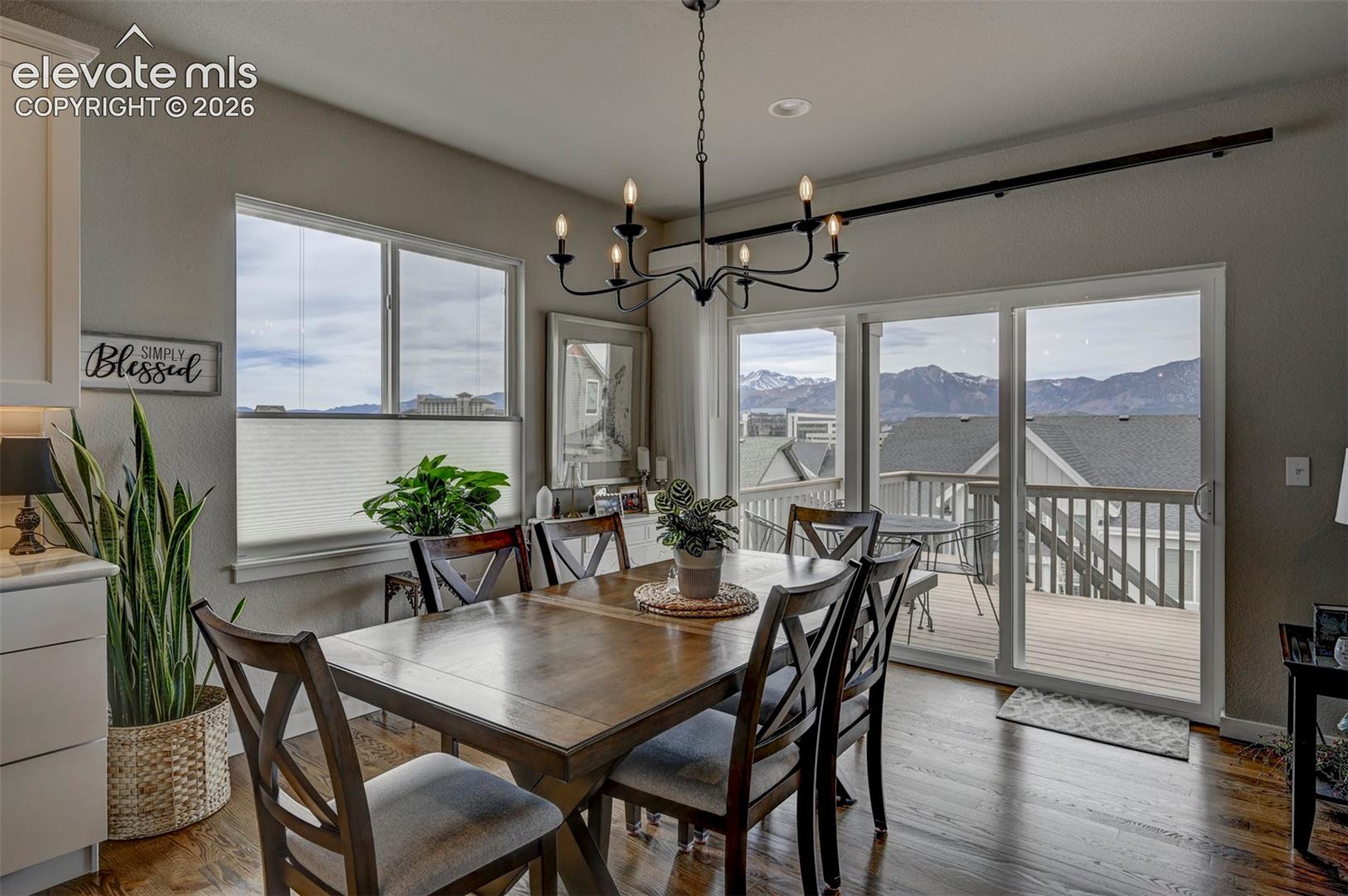 Wood-finish flooring throughout, complemented by a multi-pane window and sliding glass door