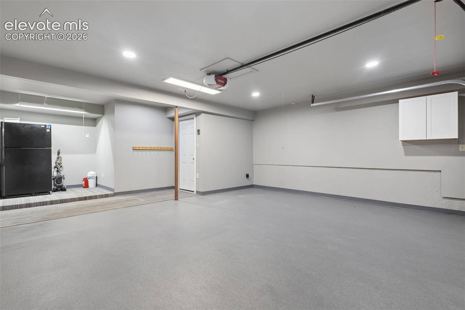 Attached garage with drywall/paint finish, epoxy and carpet flooring!