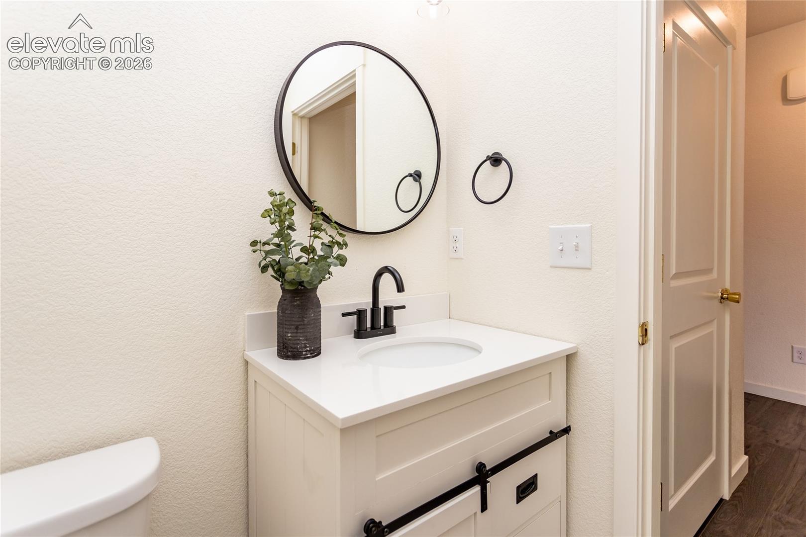 Beautiful powder room and a coat closet are located near the entry.