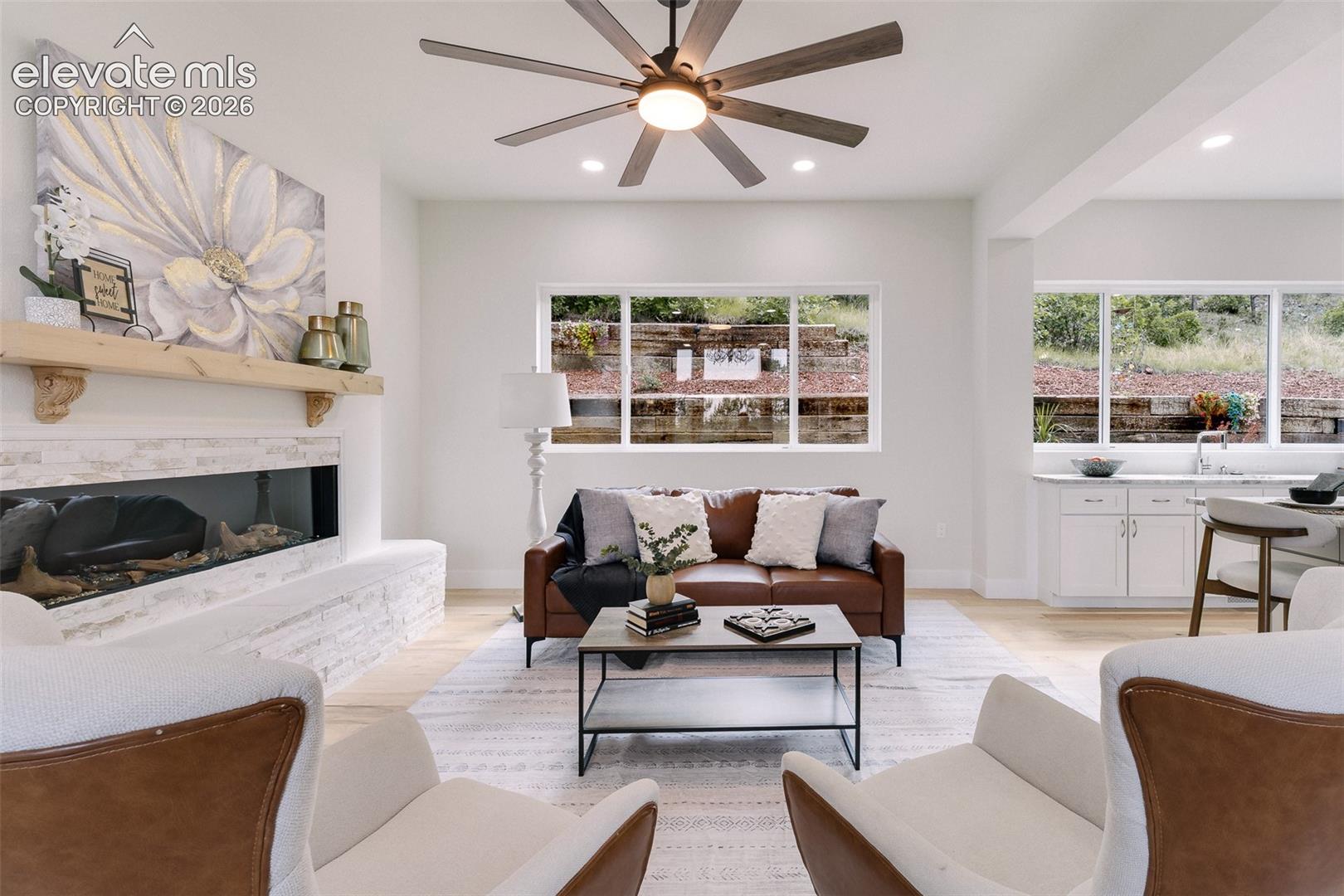 Great Room with walls of windows that bring in lots of natural light.