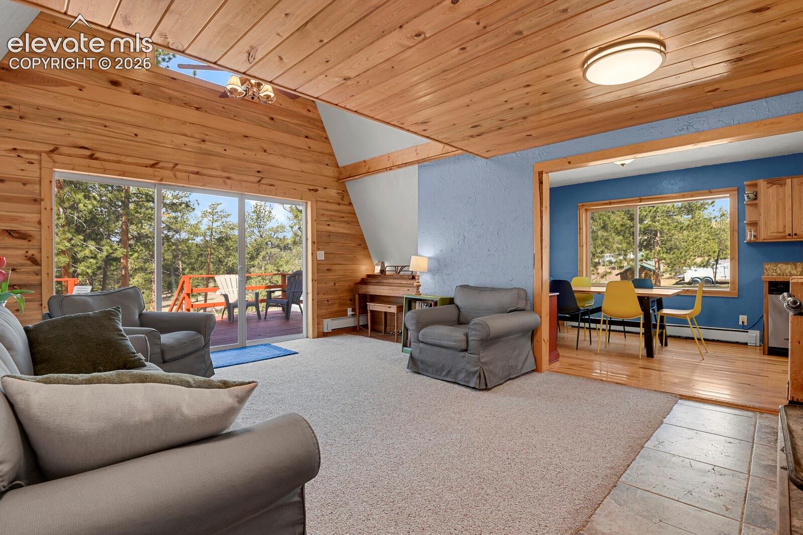 Main level adjoining kitchen and overlooking back deck