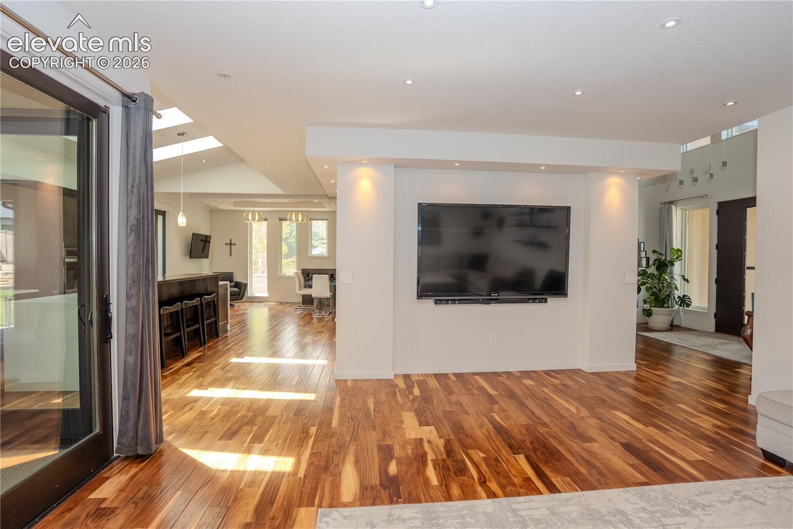 From the living room, you can see the entrance and kitchen