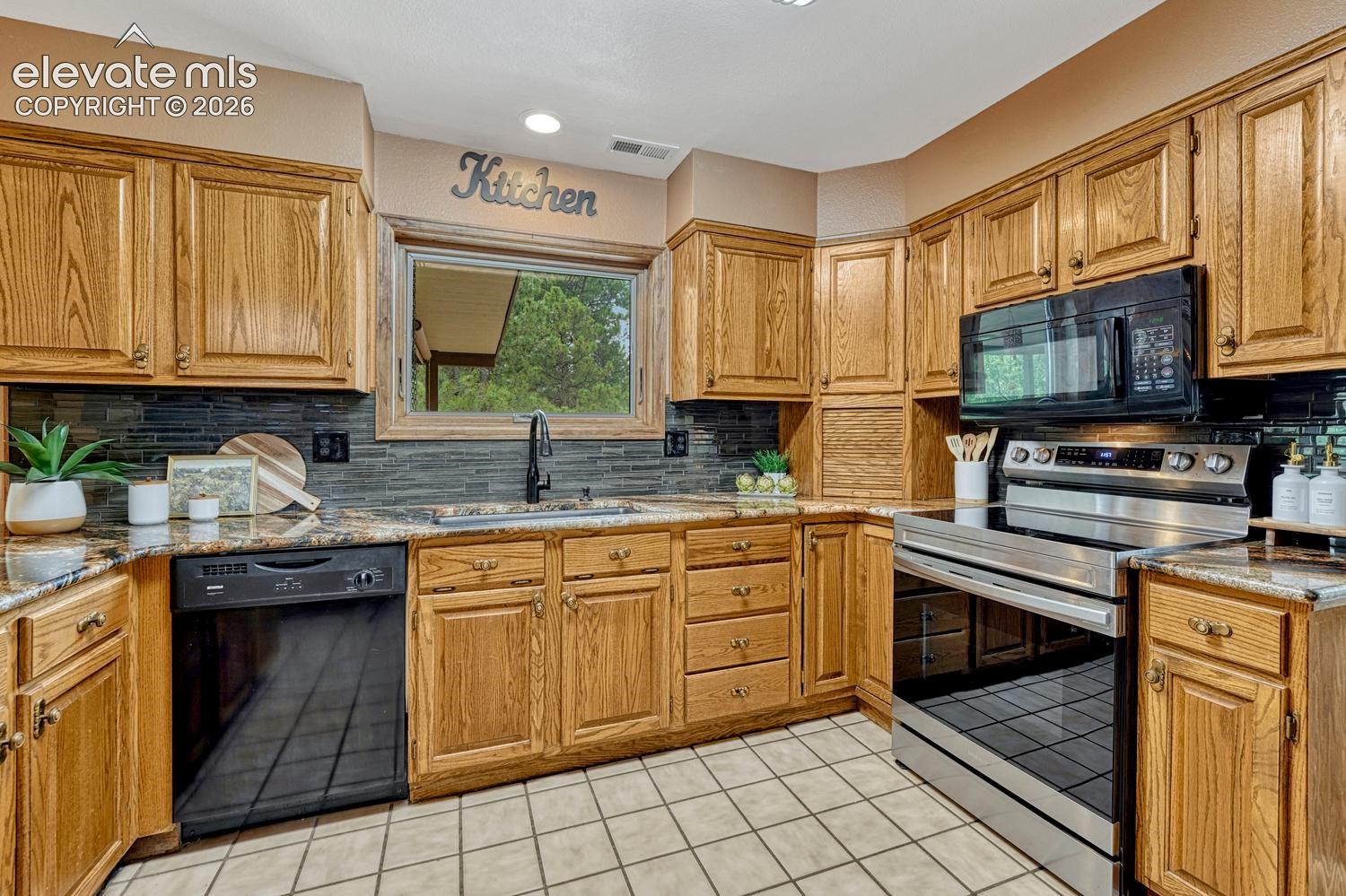 
Appliances include a smooth top range oven, overhead microwave, dishwasher, and French door refrigerator.
