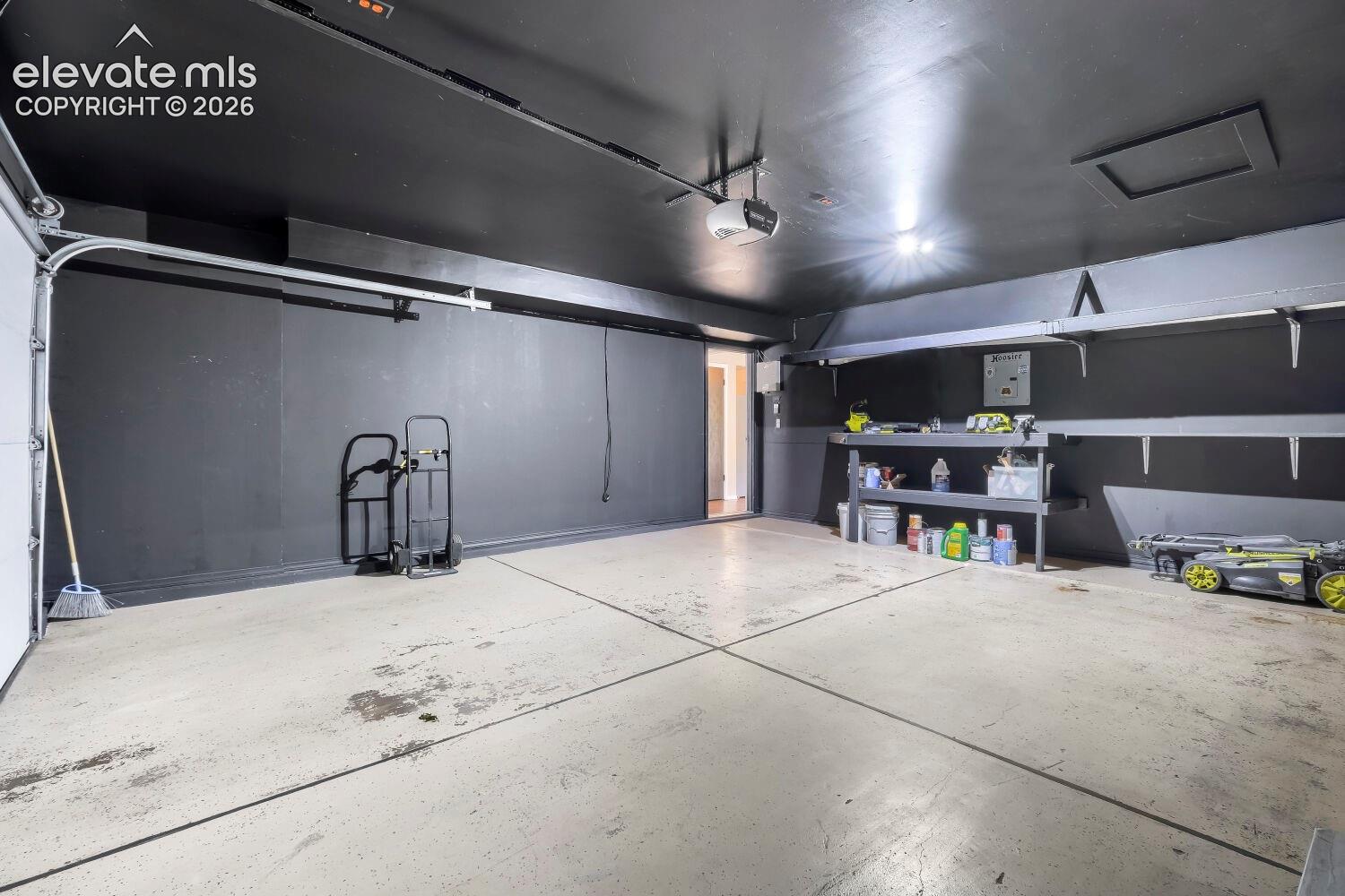 Garage with work bench and storage