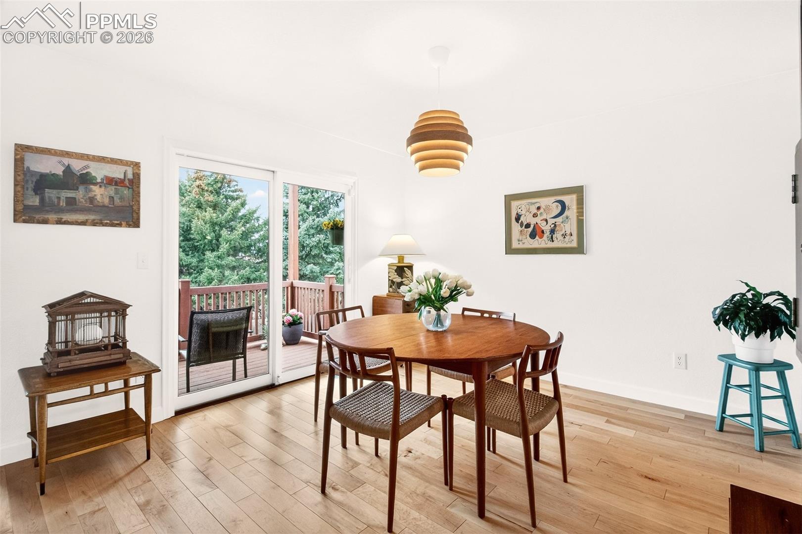 Dining area featuring new sliding glass door providing easy access to the covered 8x11 trex deck.