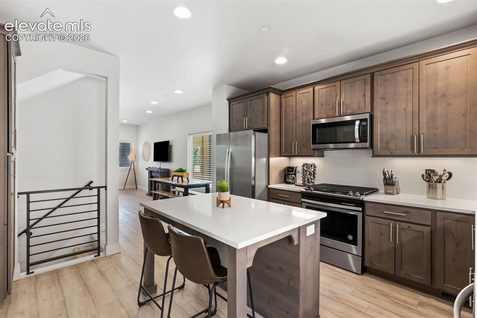 Kitchen with center island and walk out access to back yard