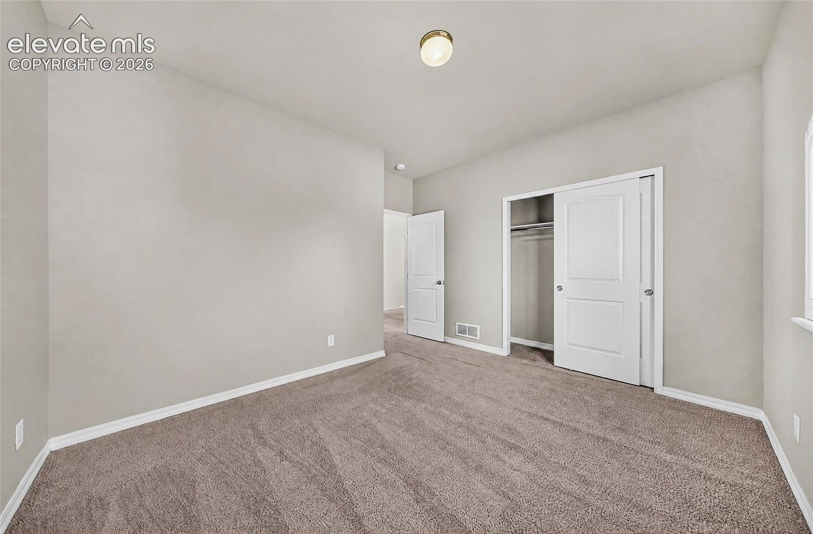 Neutral wall paint with white trim