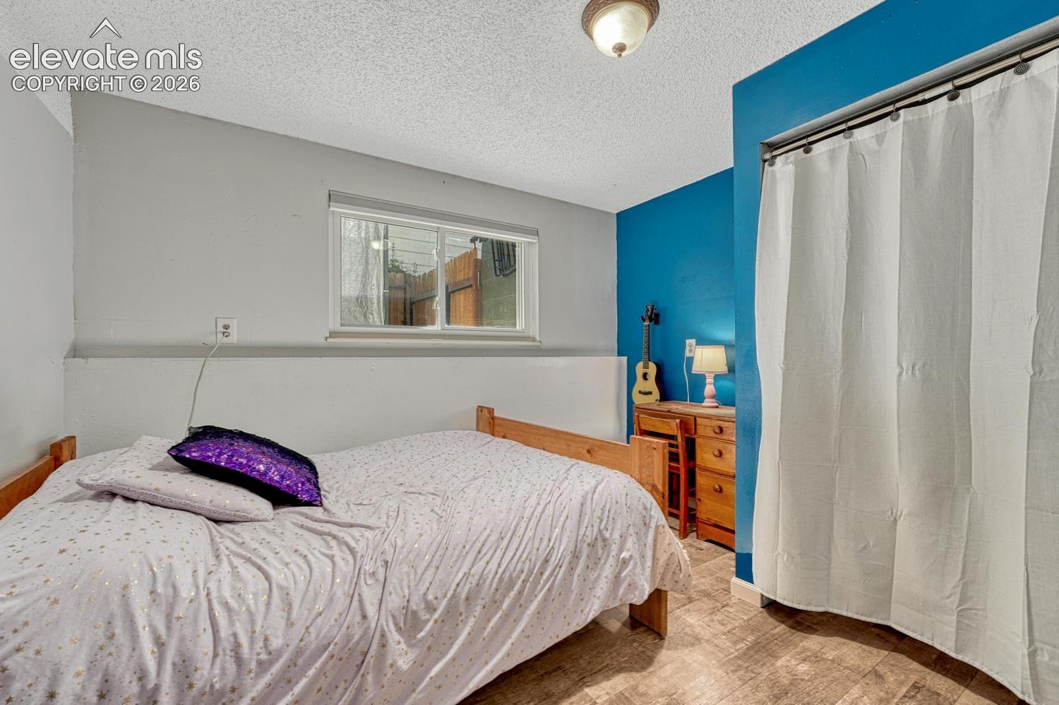 The Lower Level Bedroom with LVP flooring offers privacy for great for guests or multigenerational living.
