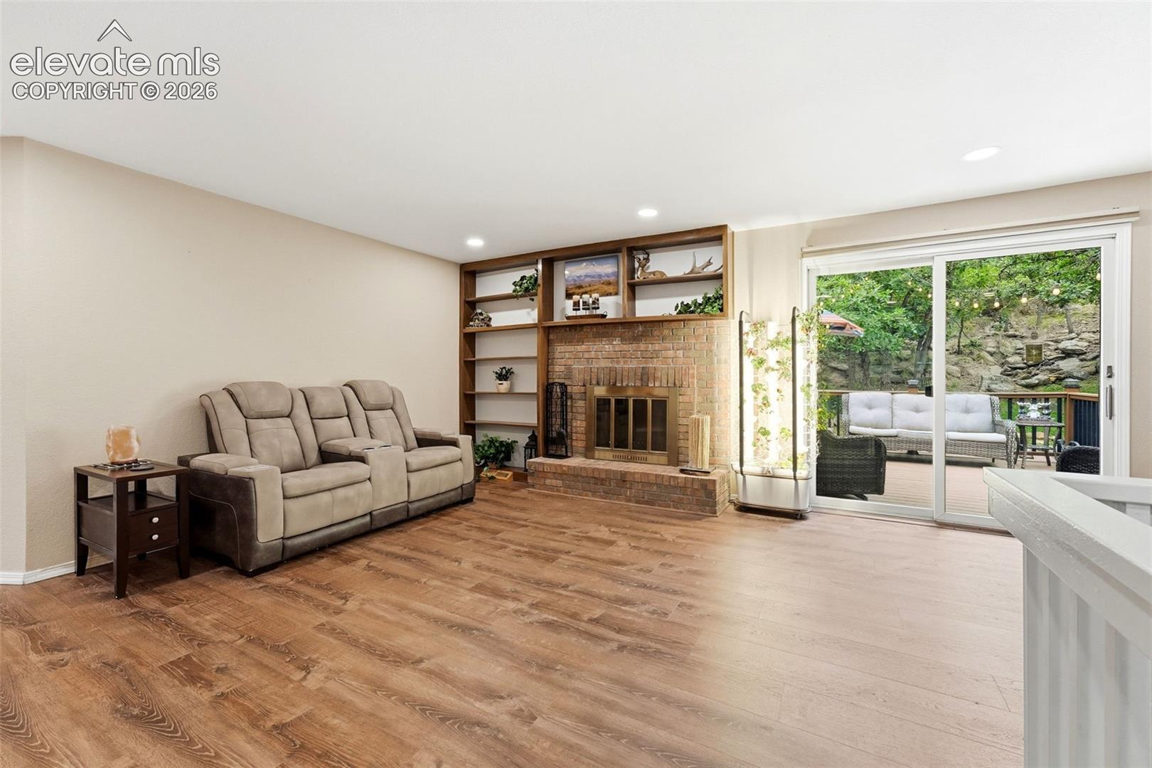 Family room The family room is open to the kitchen with wood-burning fireplace and walk out to the back yard