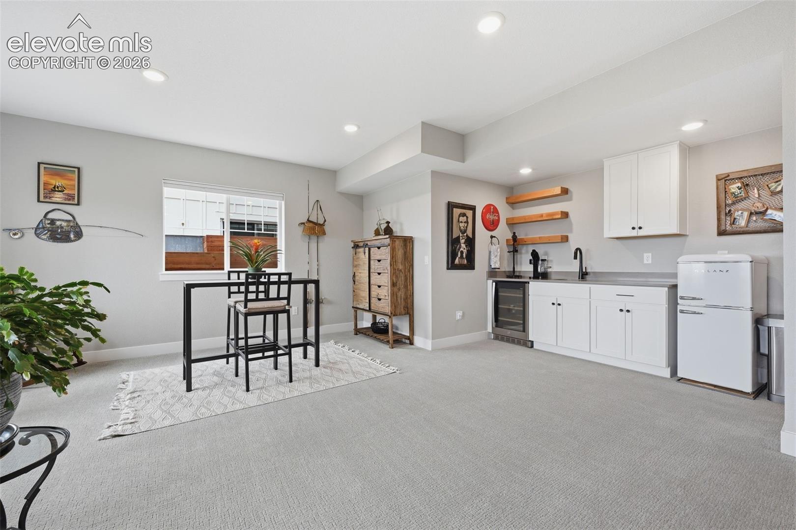 wet bar with refrigerator and beverage fridge