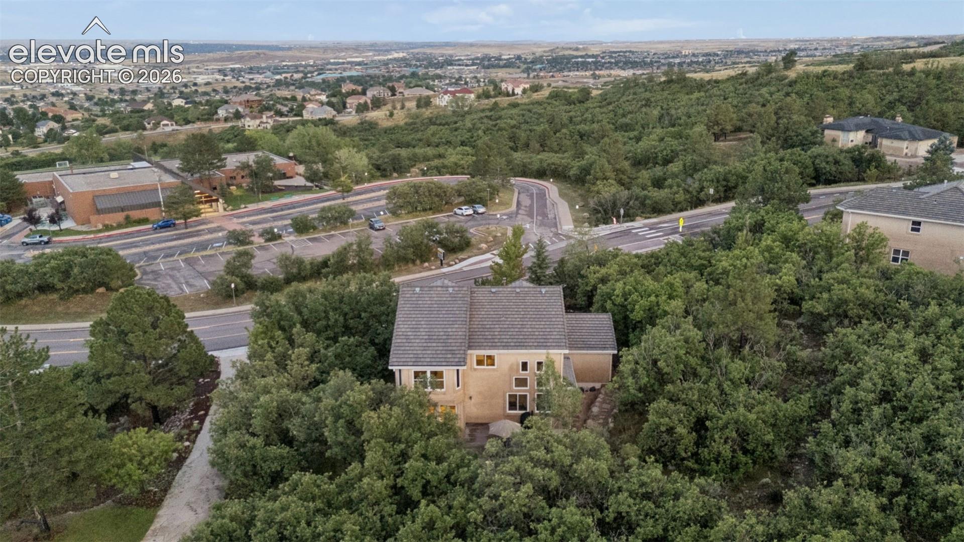 Mature trees surround the almost 1 acre lot.  