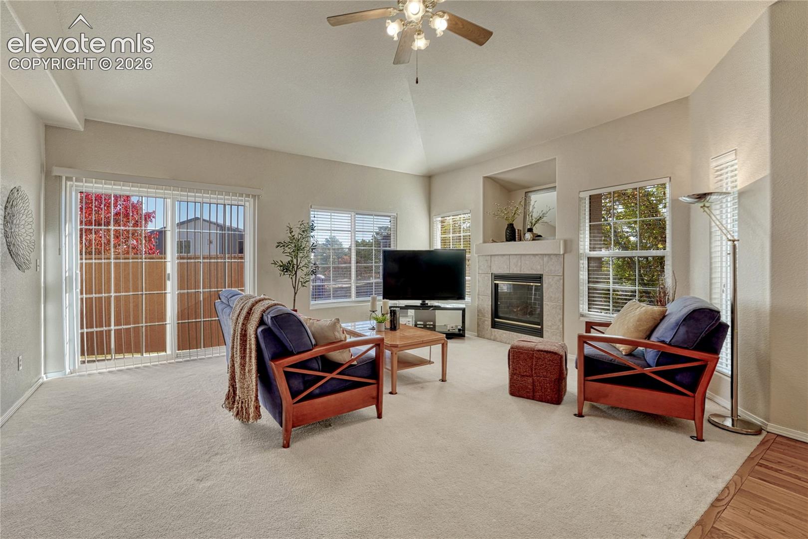 Center your living space around the cozy gas-log fireplace with mantel and media niche, surrounded by oversized windows that fill the home with natural light
