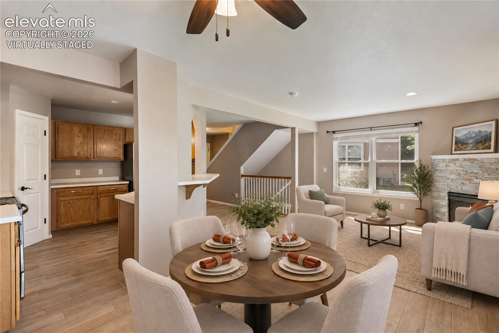 Virtually Staged-New floors and stacked stone on fireplace. Walks out to back deck.