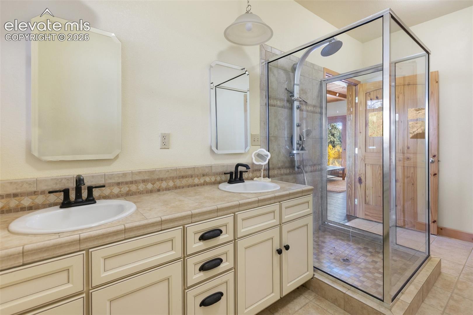 3/4 bathroom with 2 sinks. 