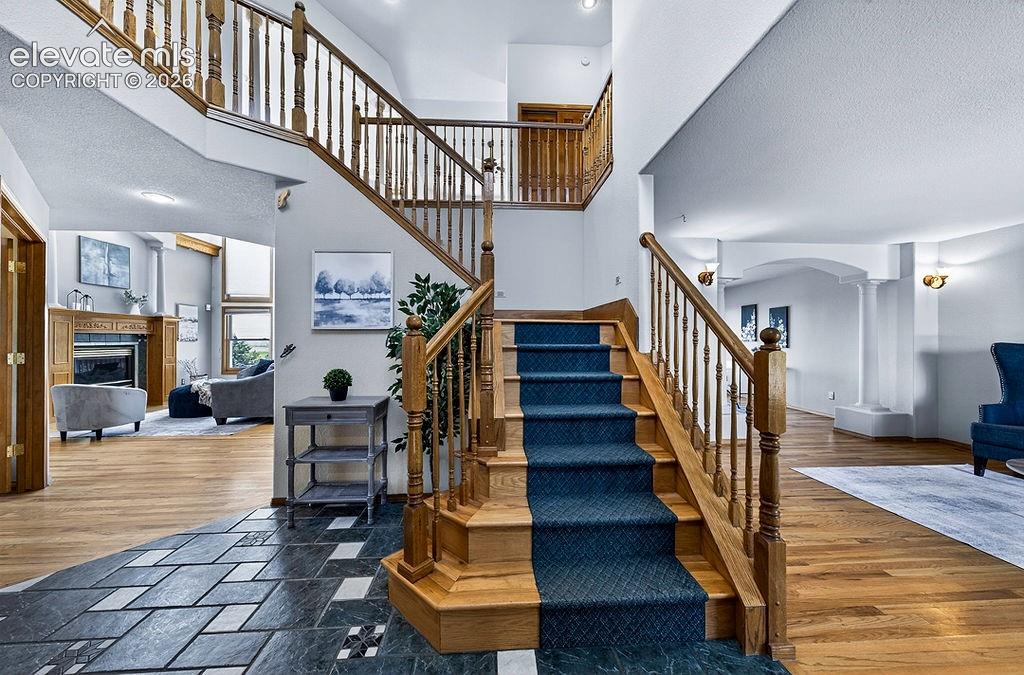 Sweeping stairs opening to the foyer!