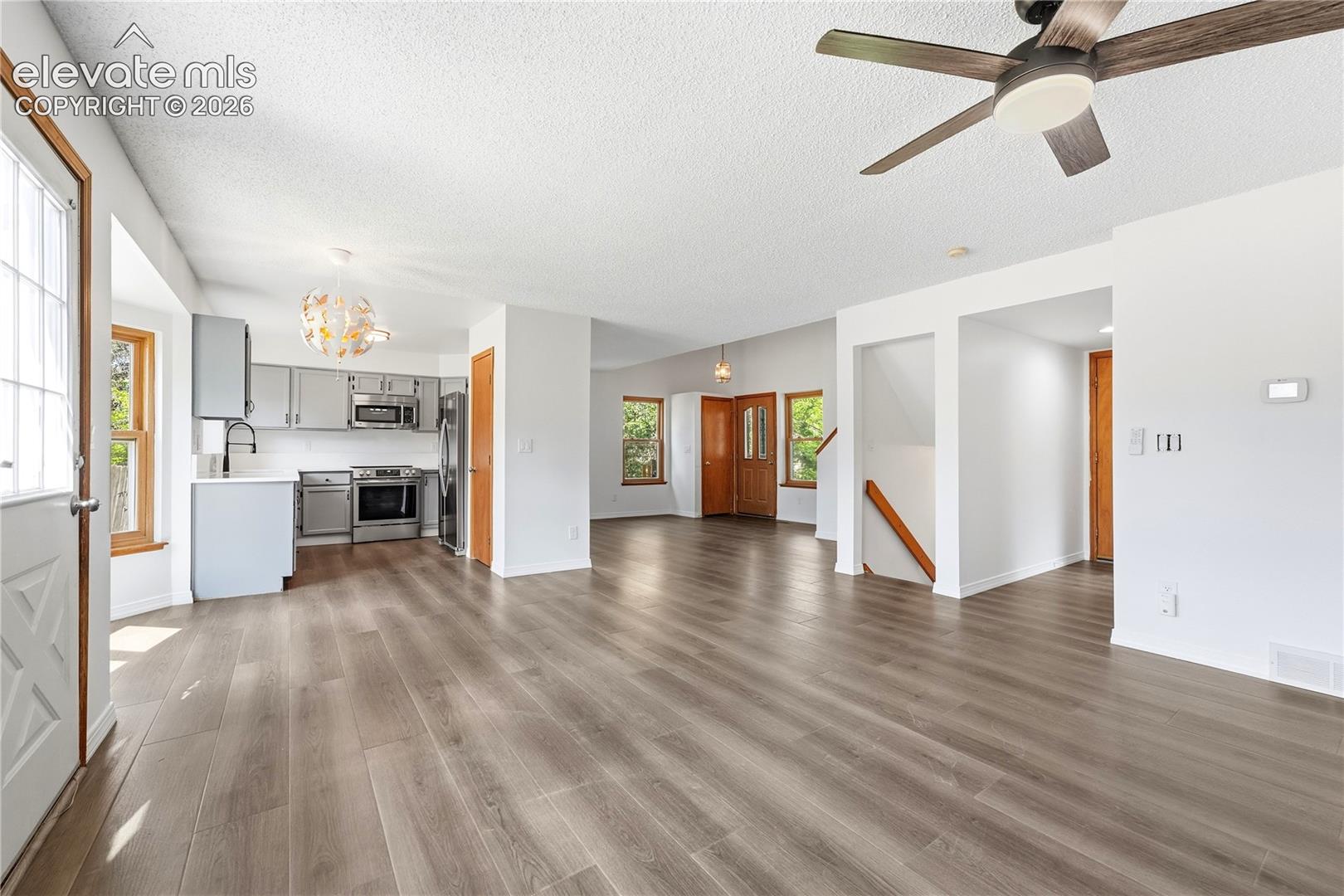 Dining area with new LVP flooring, and additional living room or family room