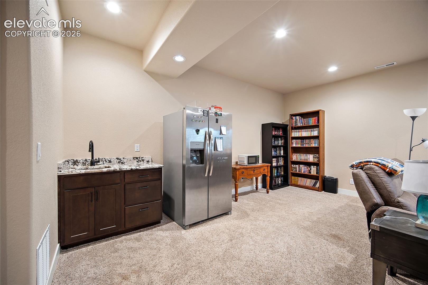 Lower level wet bar and refrigerator