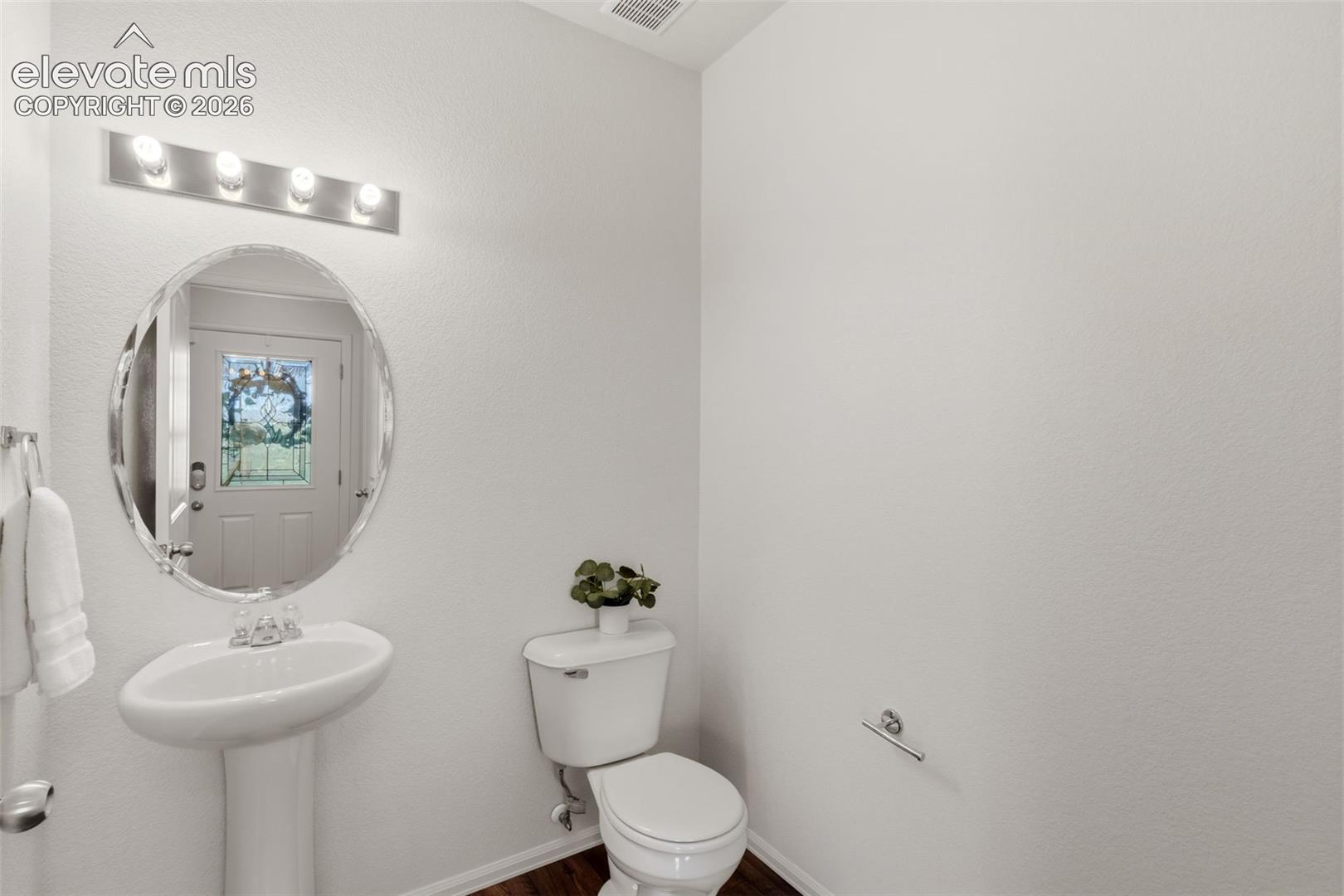 A convenient main-level half bathroom offers excellent functionality for you and your guests