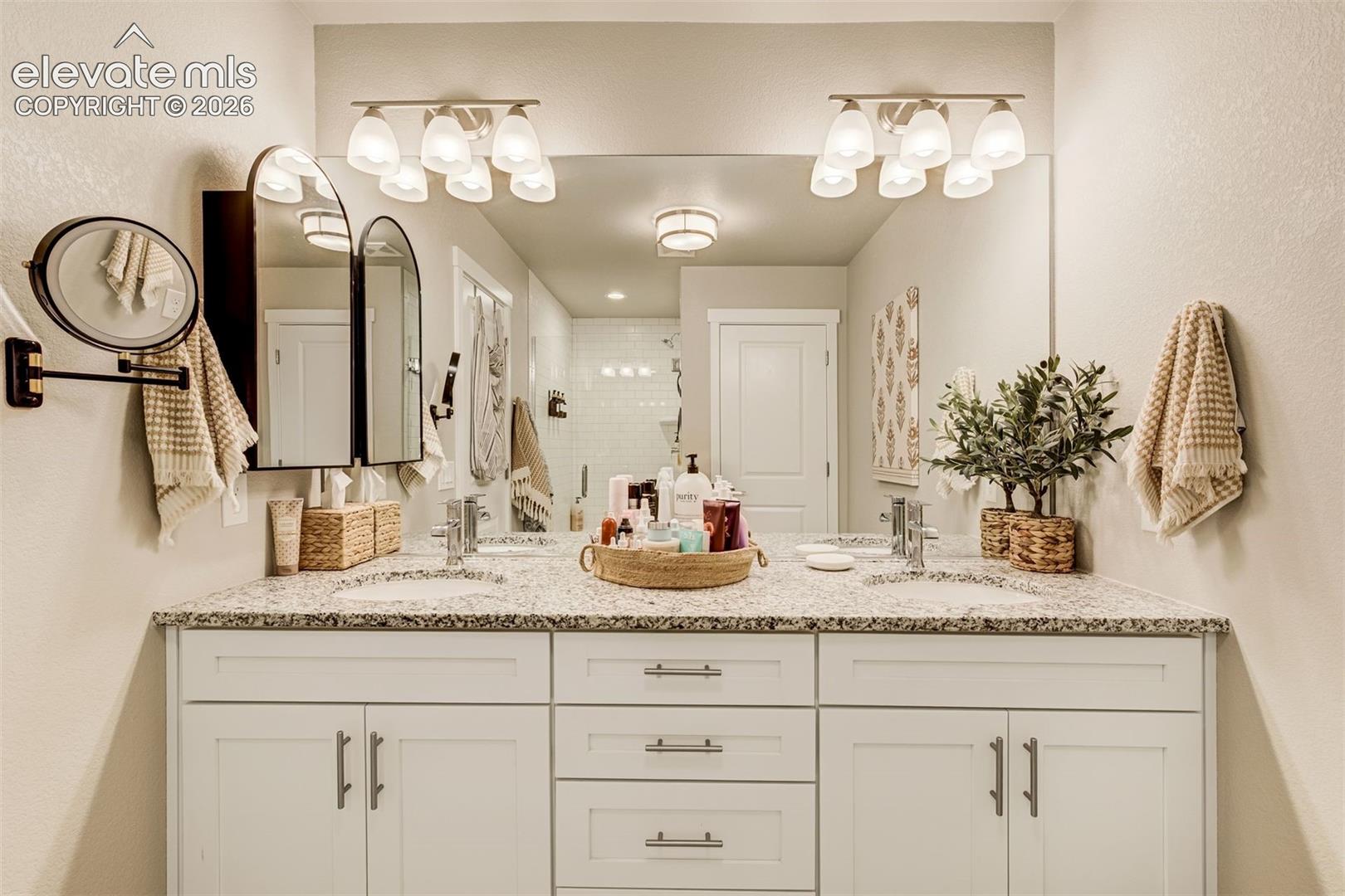 Dual vanity in the attached primary bathroom