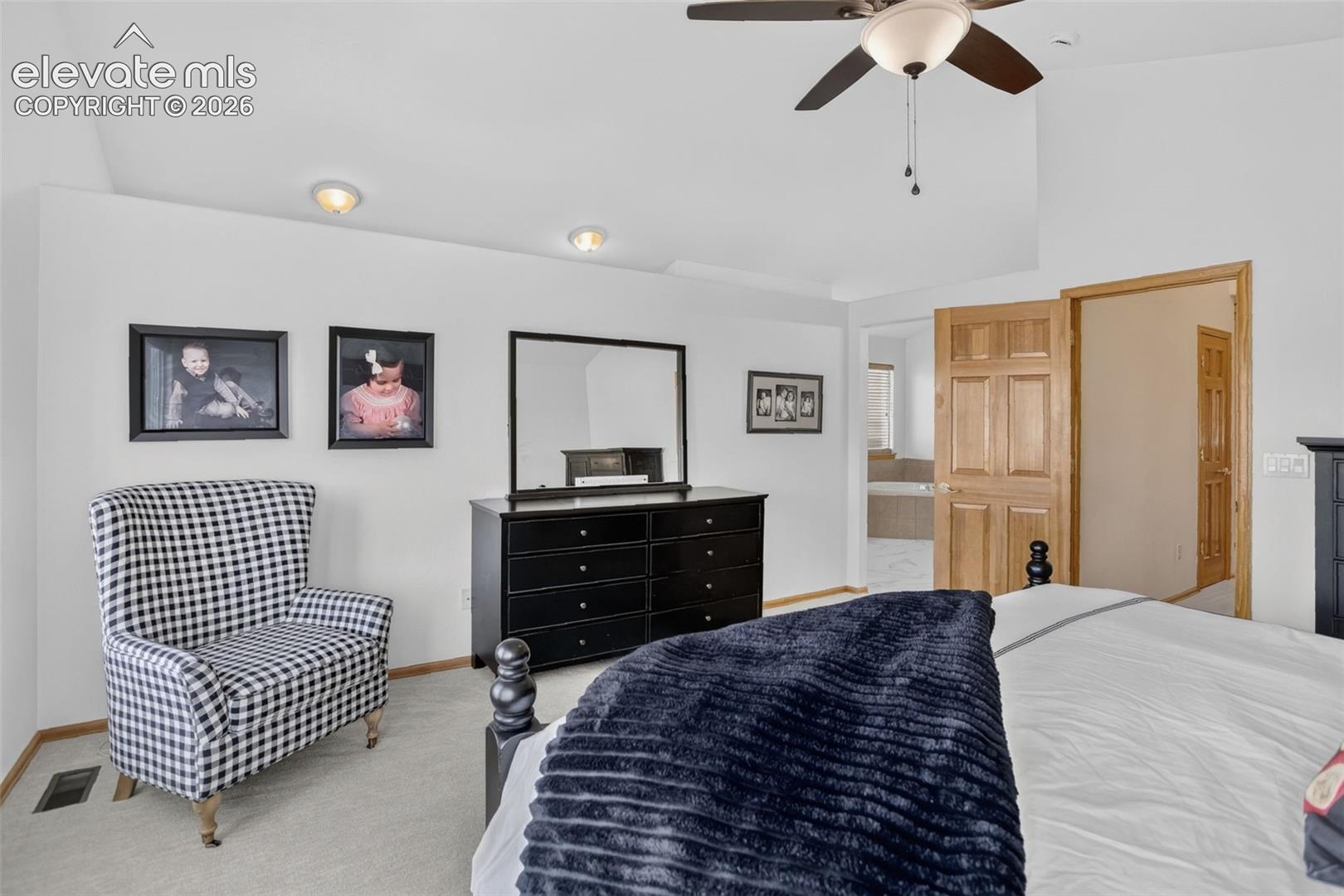 Vaulted ceiling with ceiling fan and recessed lighting