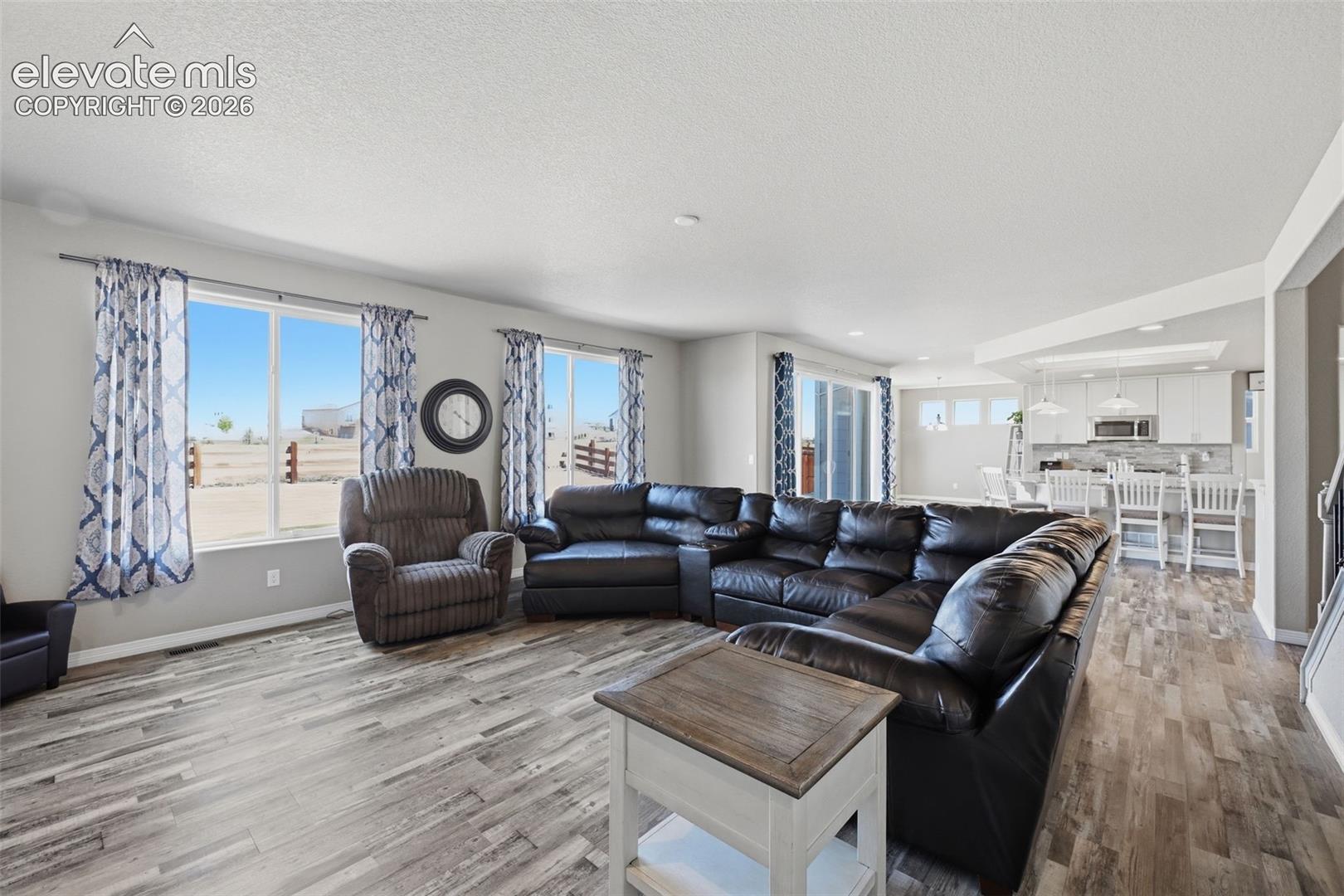 Great Room Opens Seamlessly to the Kitchen for Easy Conversation & Entertaining