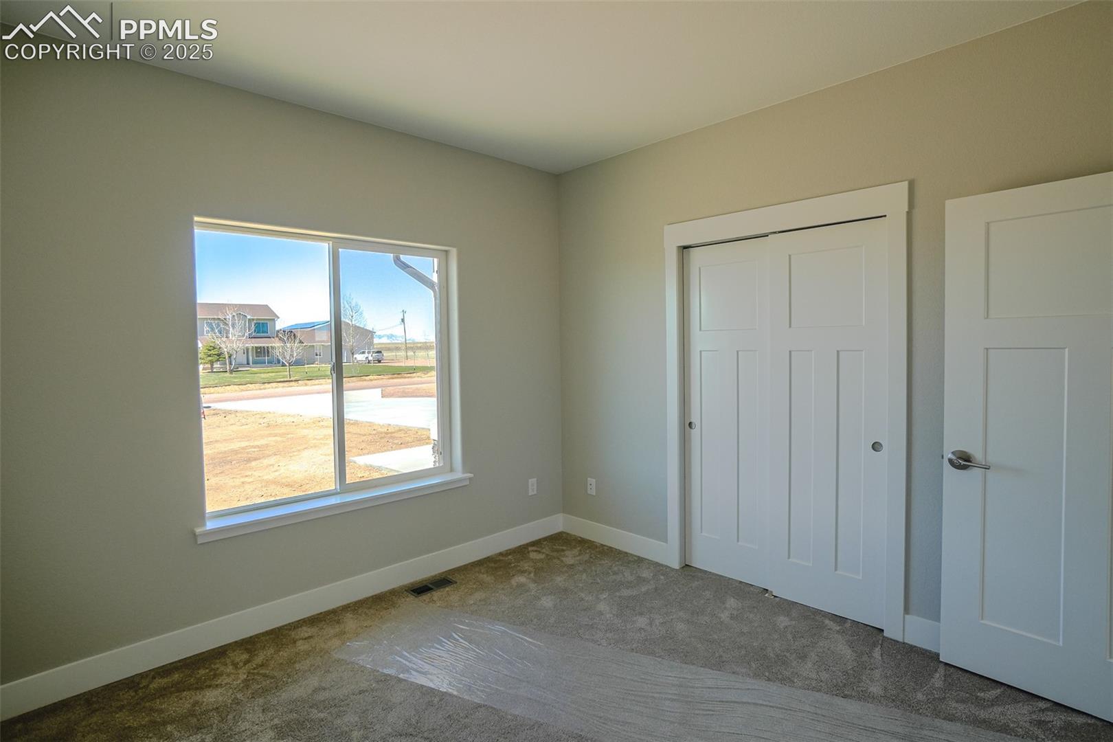 Unfurnished #2 bedroom featuring a closet and carpet floors