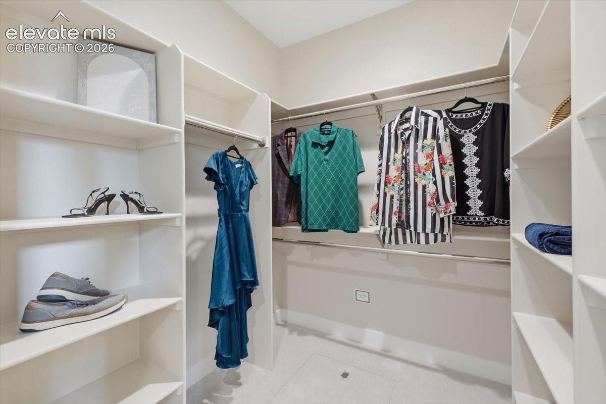 Primary Suite Walk-in Closet with Custom Built-ins.
