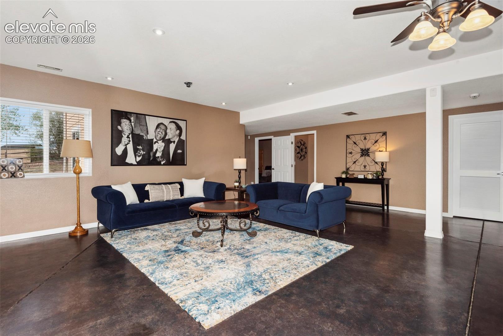 Basement Area has a Beautifully 
Stained Concrete Floor, Recessed Lighting, and  
Ceiling Fans