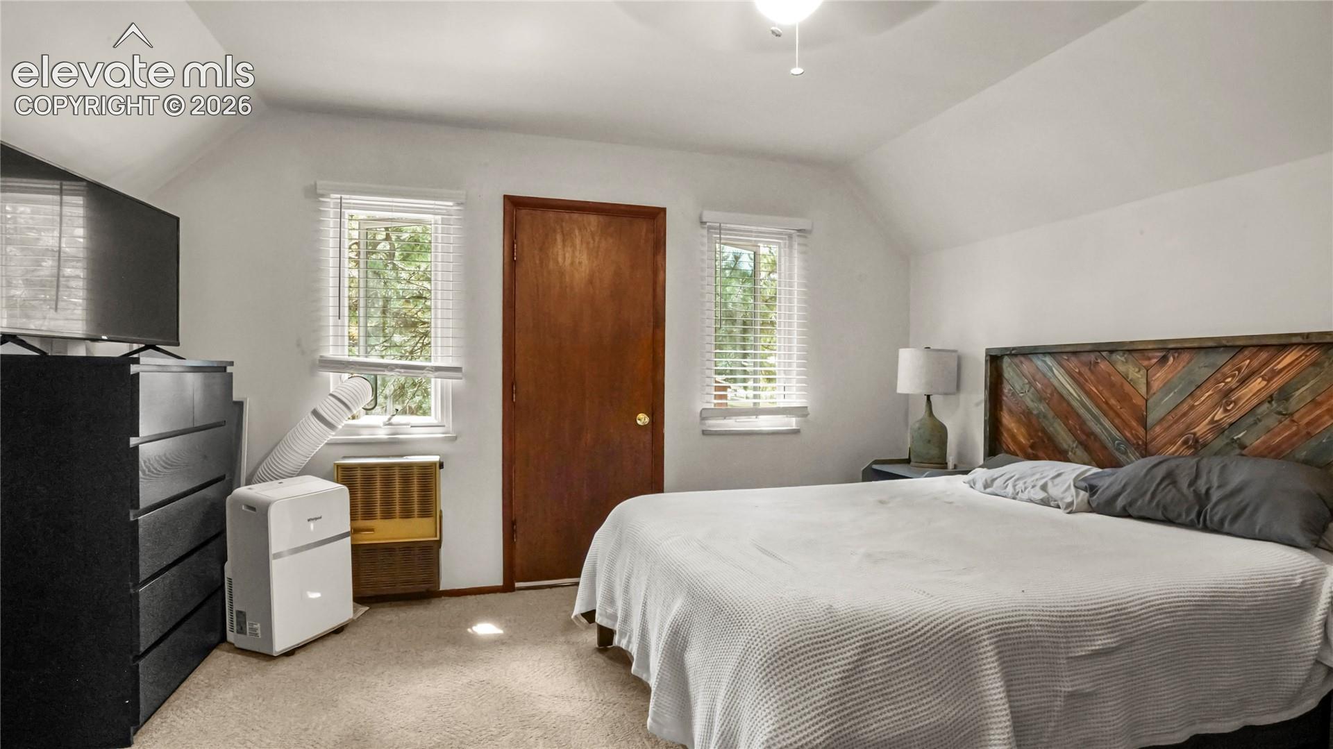 Upstairs Master Bedroom with a walk out to the separate balcony.