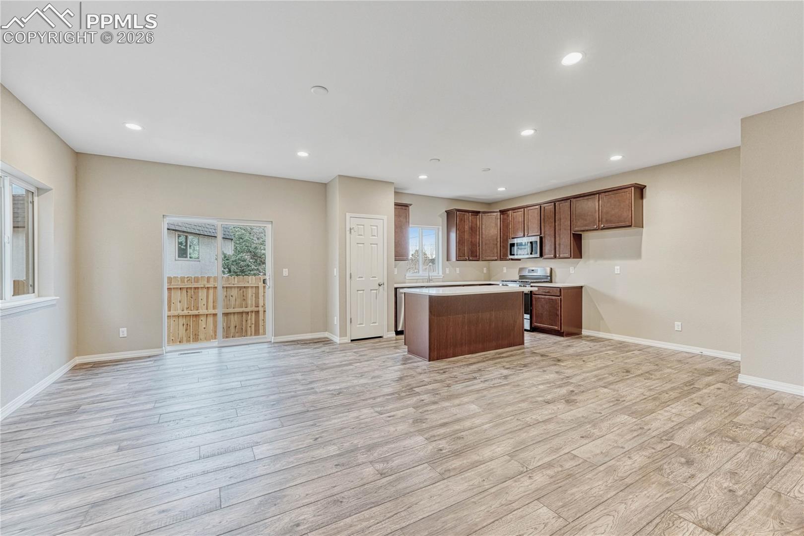 Dining area walks out to fully fenced backyard. Seamlessly move gatherings between indoors and outdoors.