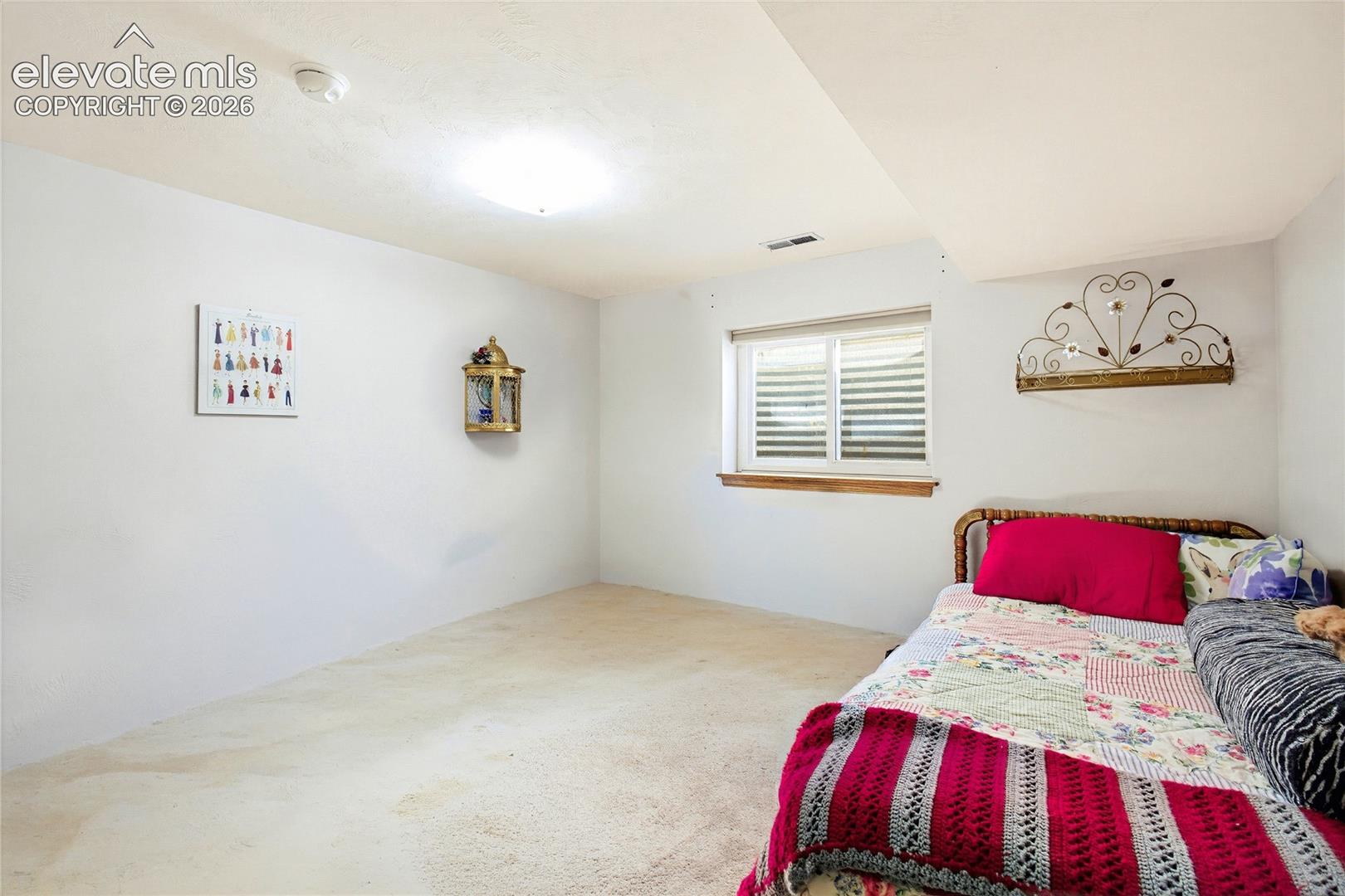 Recessed window with white blinds and wood trim