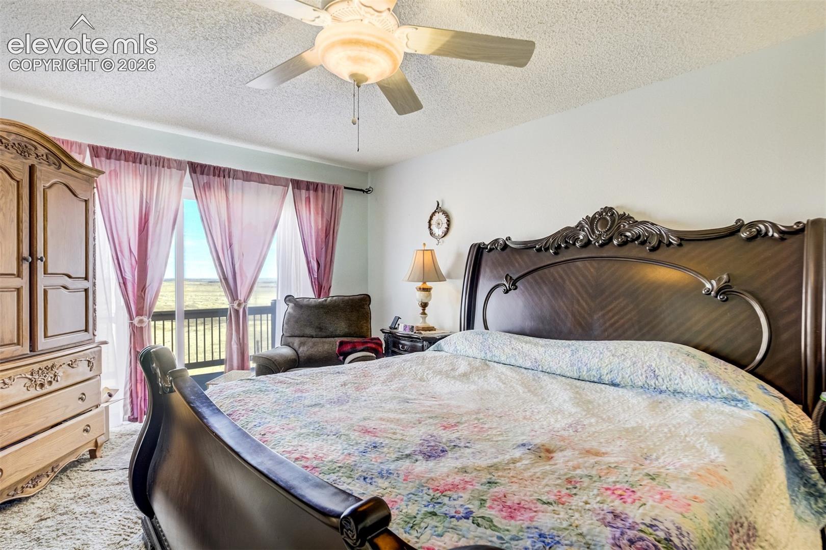 Primary bedroom has new LVP flooring.  Not the updated photo.  Walkout to a private deck.