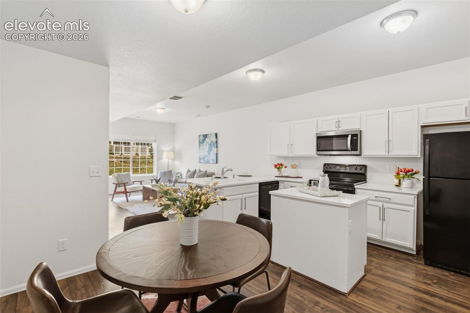 The open floor plan provides plenty of room for a dining setup to bring everyone together for meals
