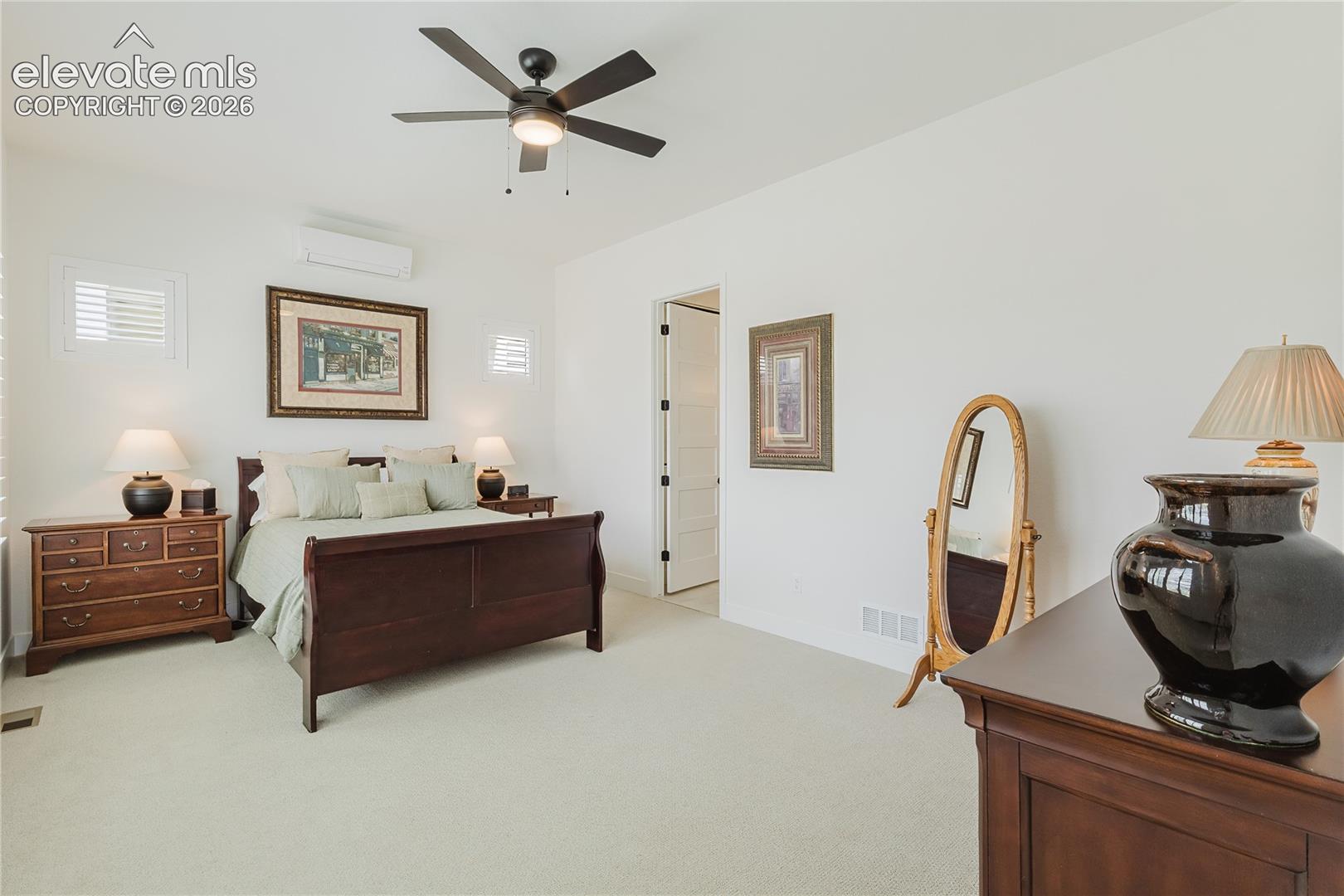 Recessed lighting, ceiling fan, carpet flooring, light walls and dedicated mini-split for extra AC