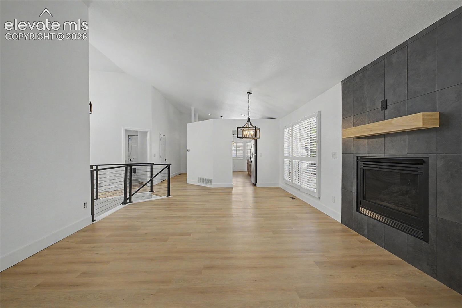 Living room with fireplace and attached separate dining