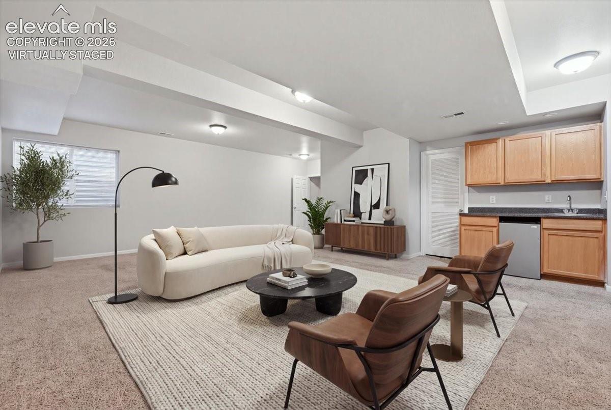 basement rec— room with wet bar. Virtually staged