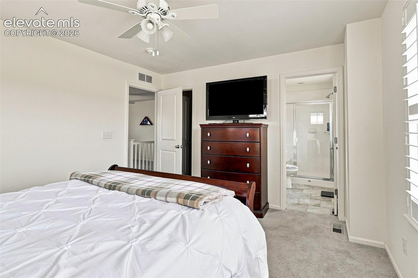 Spacious, bright and airy primary bedroom with walk-in closet