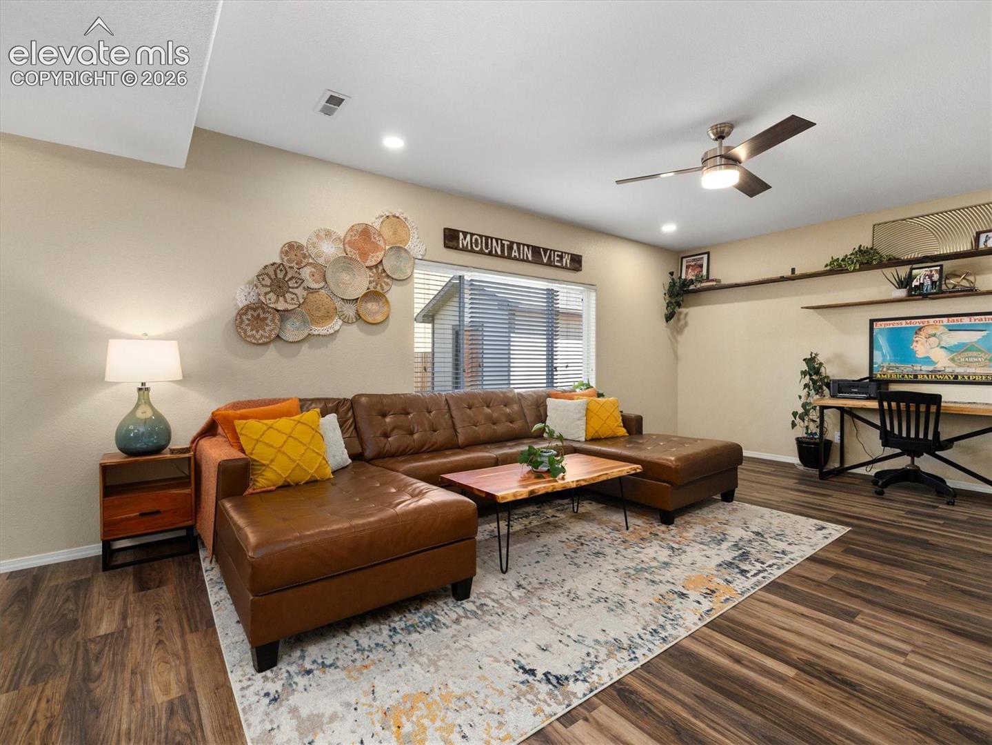Recessed lighting, LVP flooring, ceiling fan with integrated lighting, window with blinds, and built-in shelving