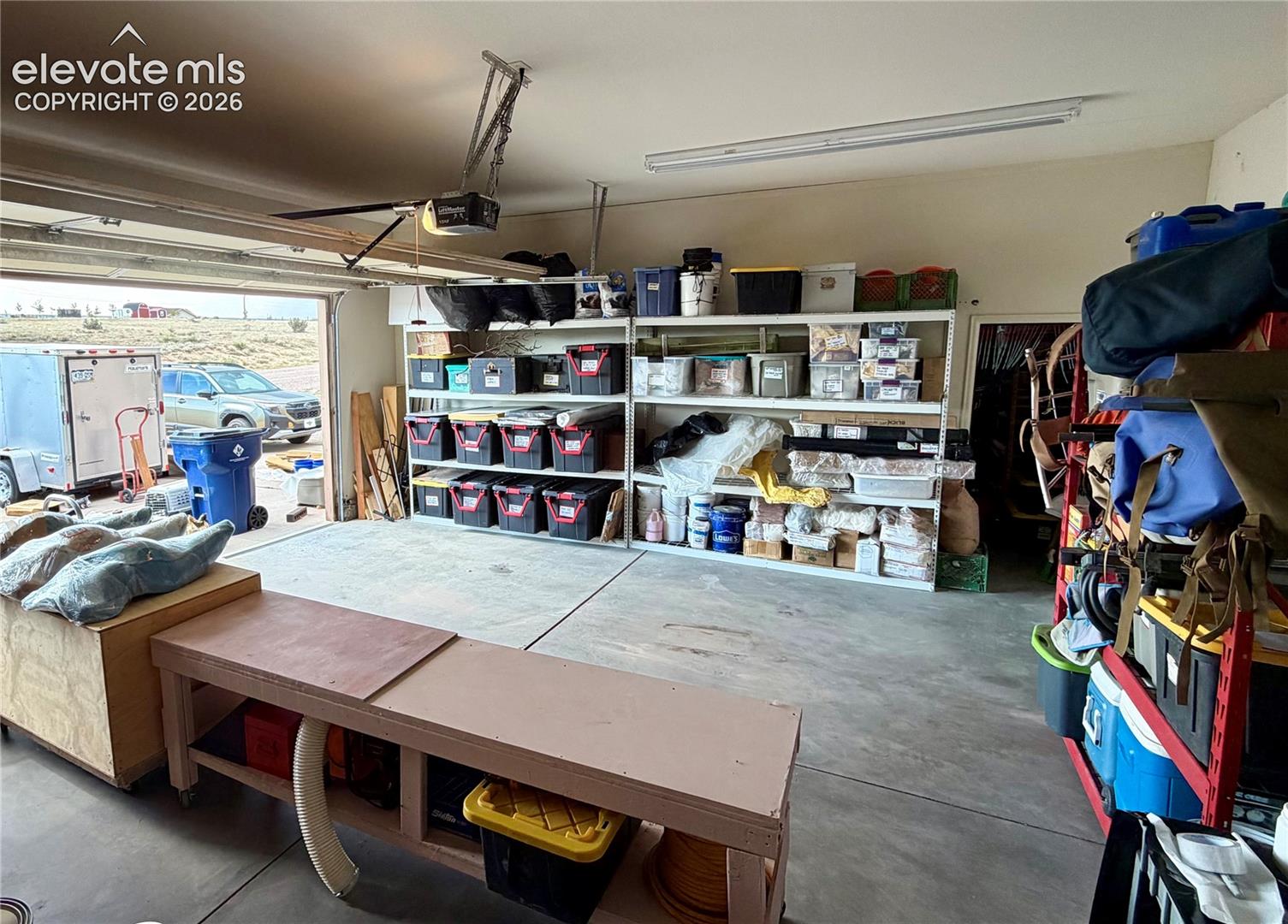 3 car garage with room for lots of storage and tall ceilings.