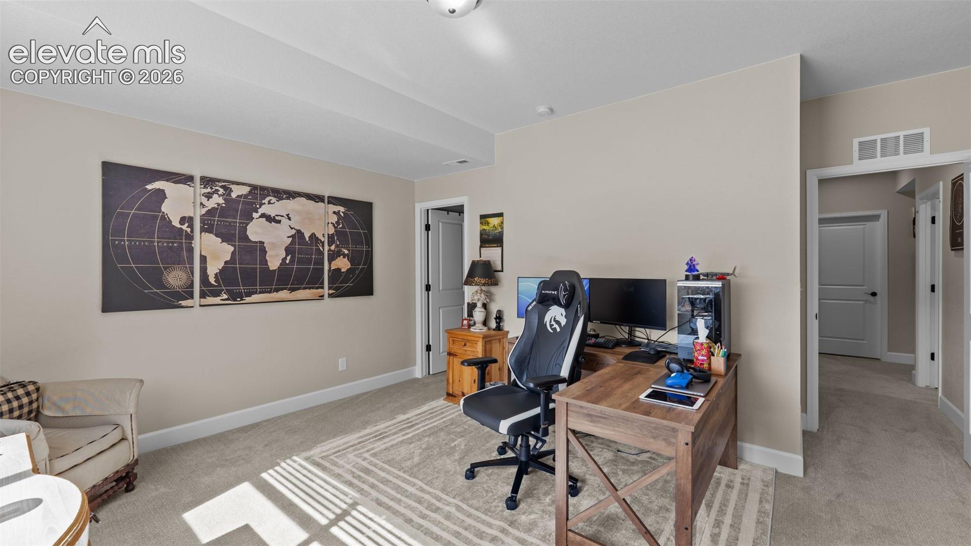 Neutral wall paint, plush carpet flooring, recessed lighting, and white trim