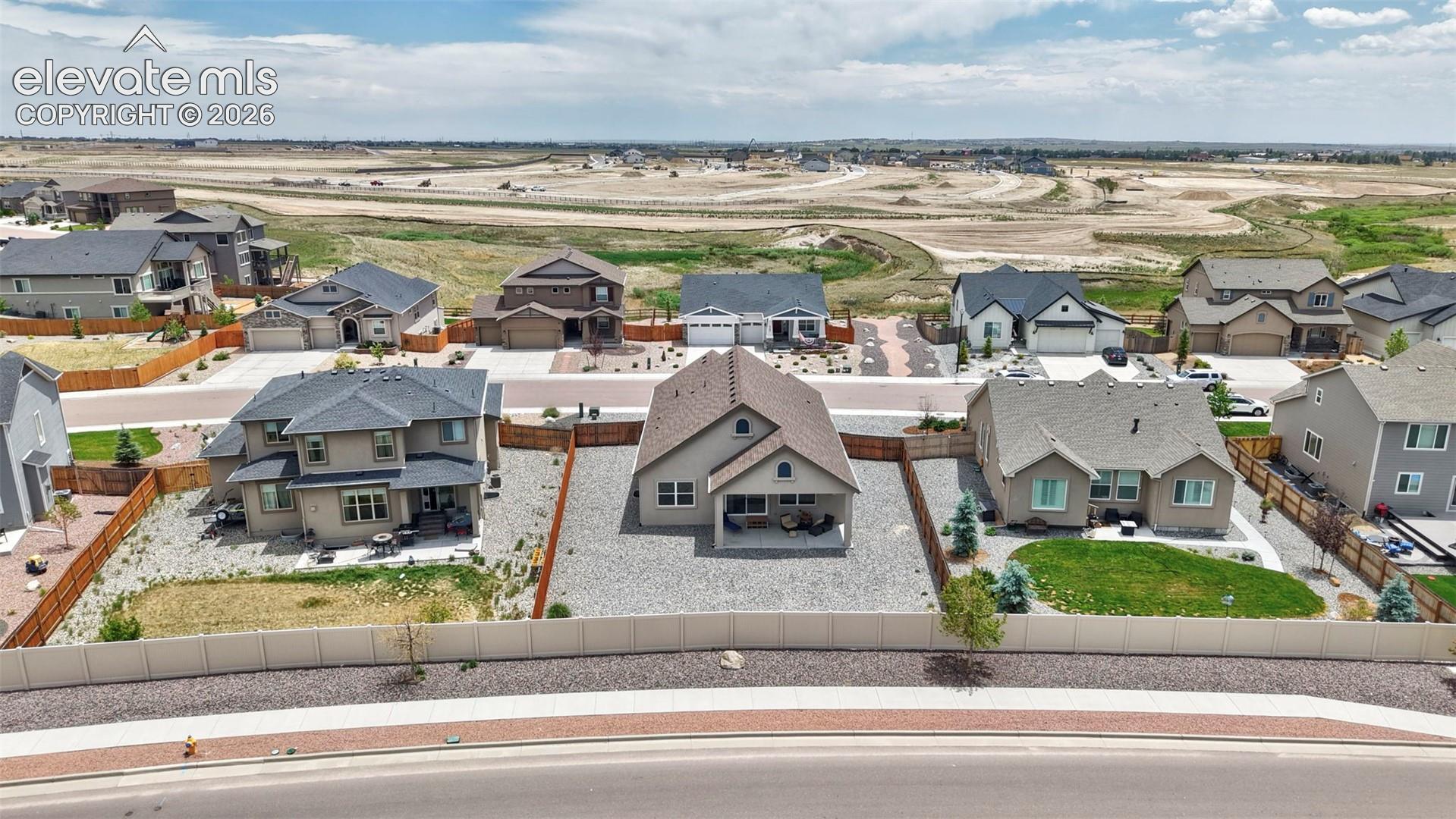 Aerial View of Back Yard and Covered Patio
