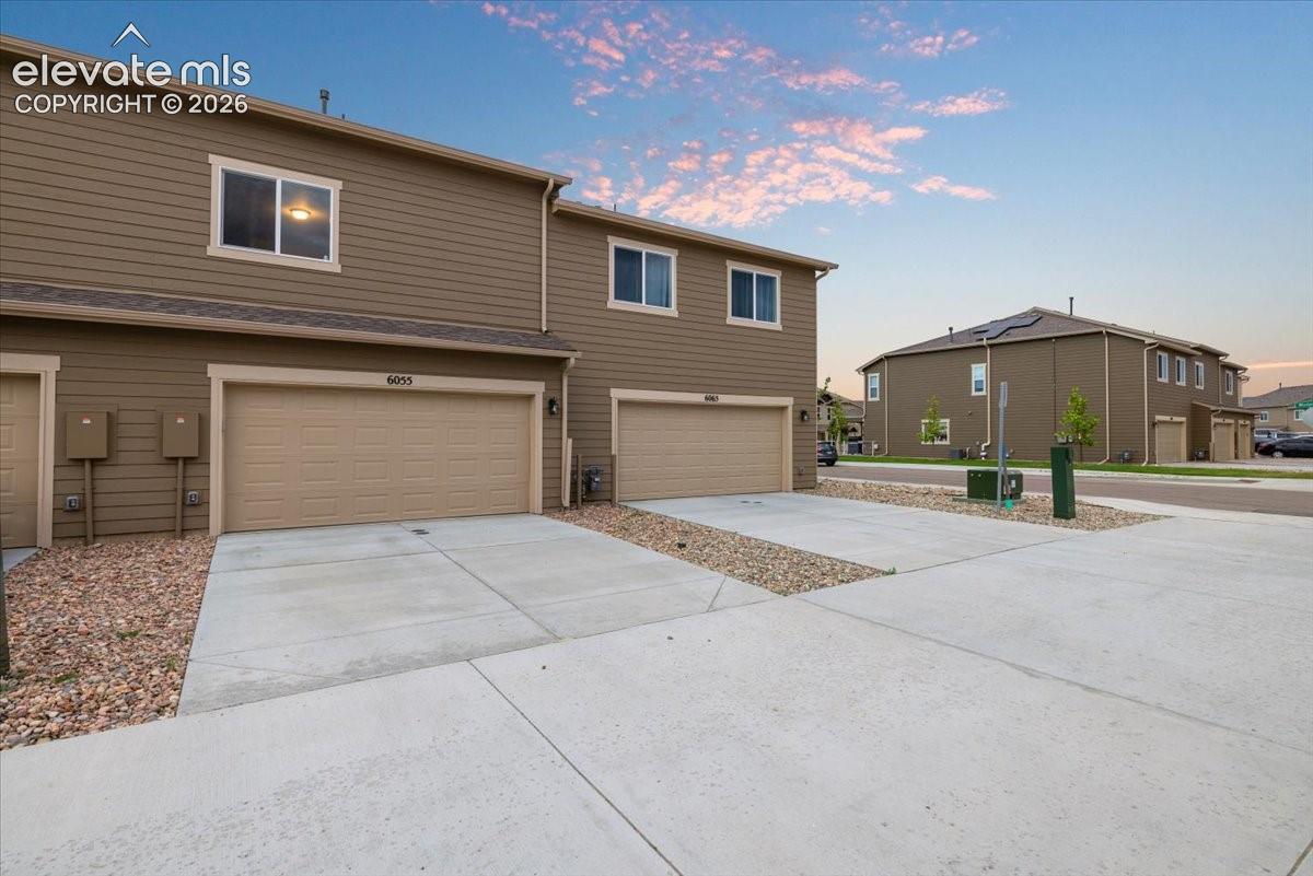 Attached two-car garage with concrete driveway