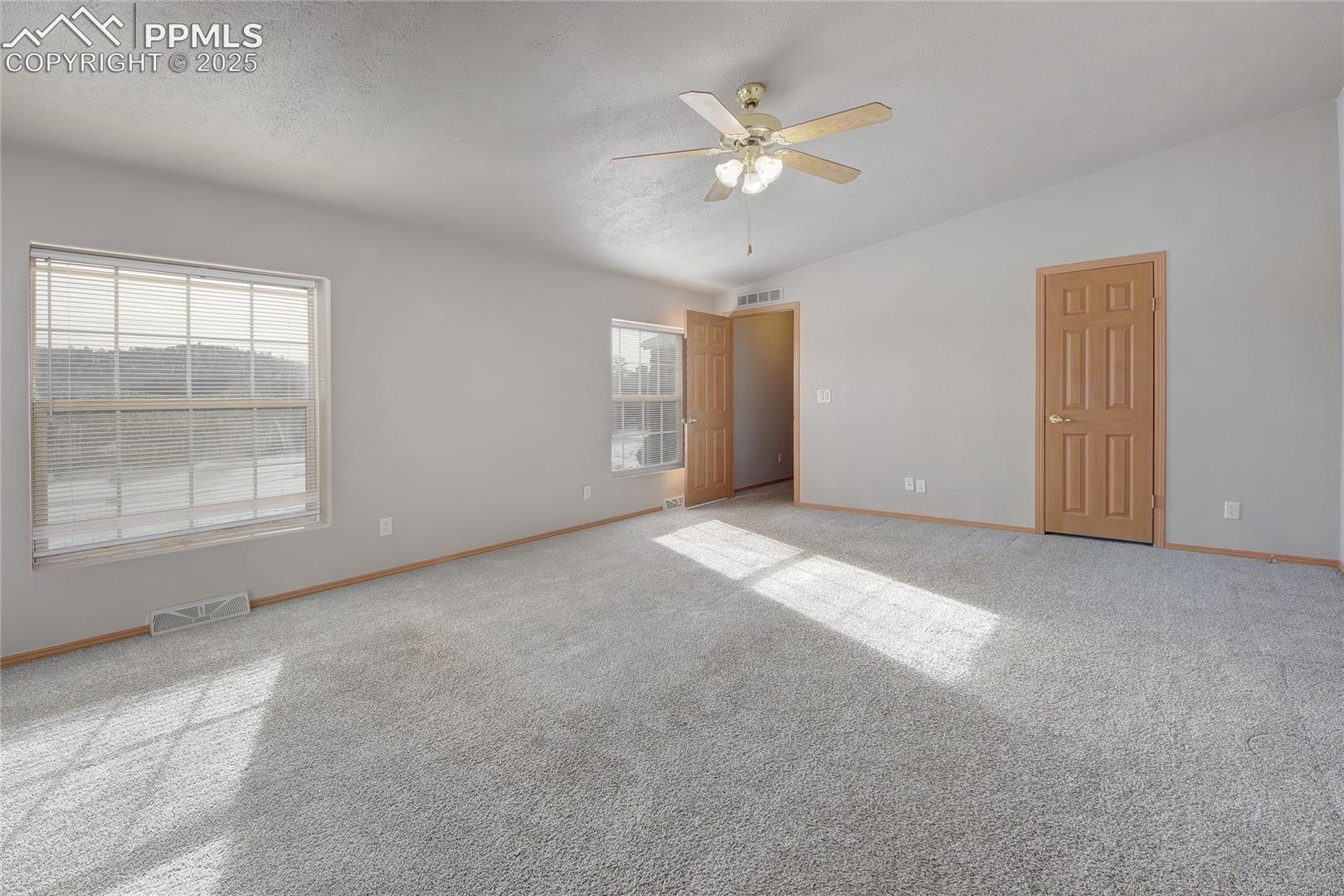 Master bedroom with ceiling fan