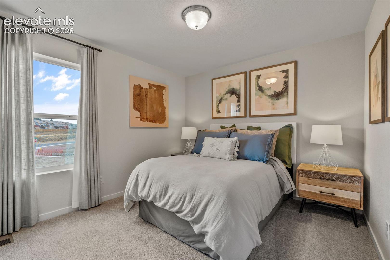 Wall-to-wall carpeting and white walls