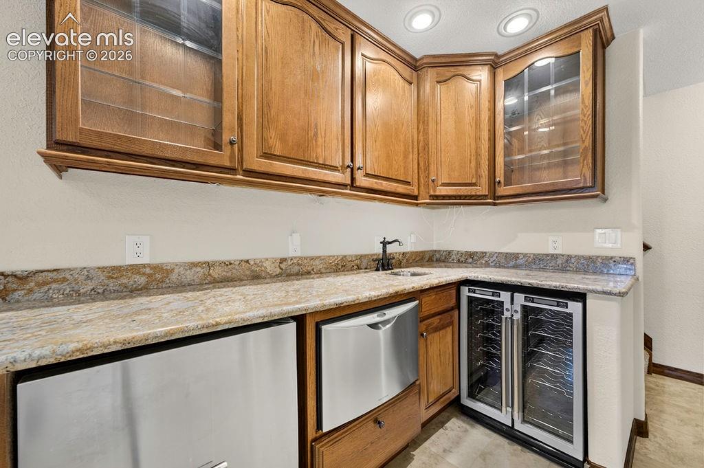Basement Wet bar- has dishwasher drawer, disposal sink, and beverage fridge