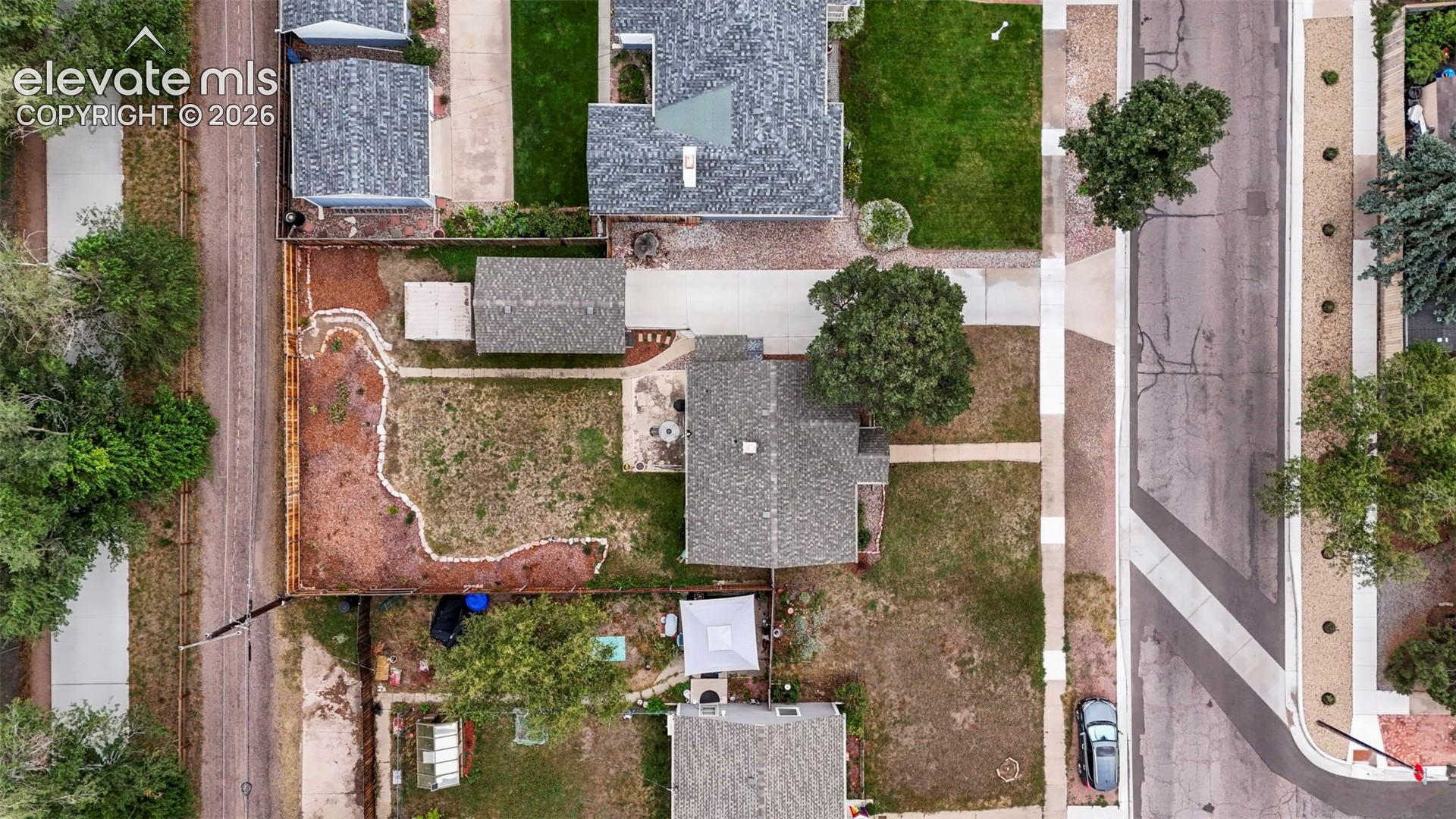 Overhead aerial shows paved rear alley and proximity to trails