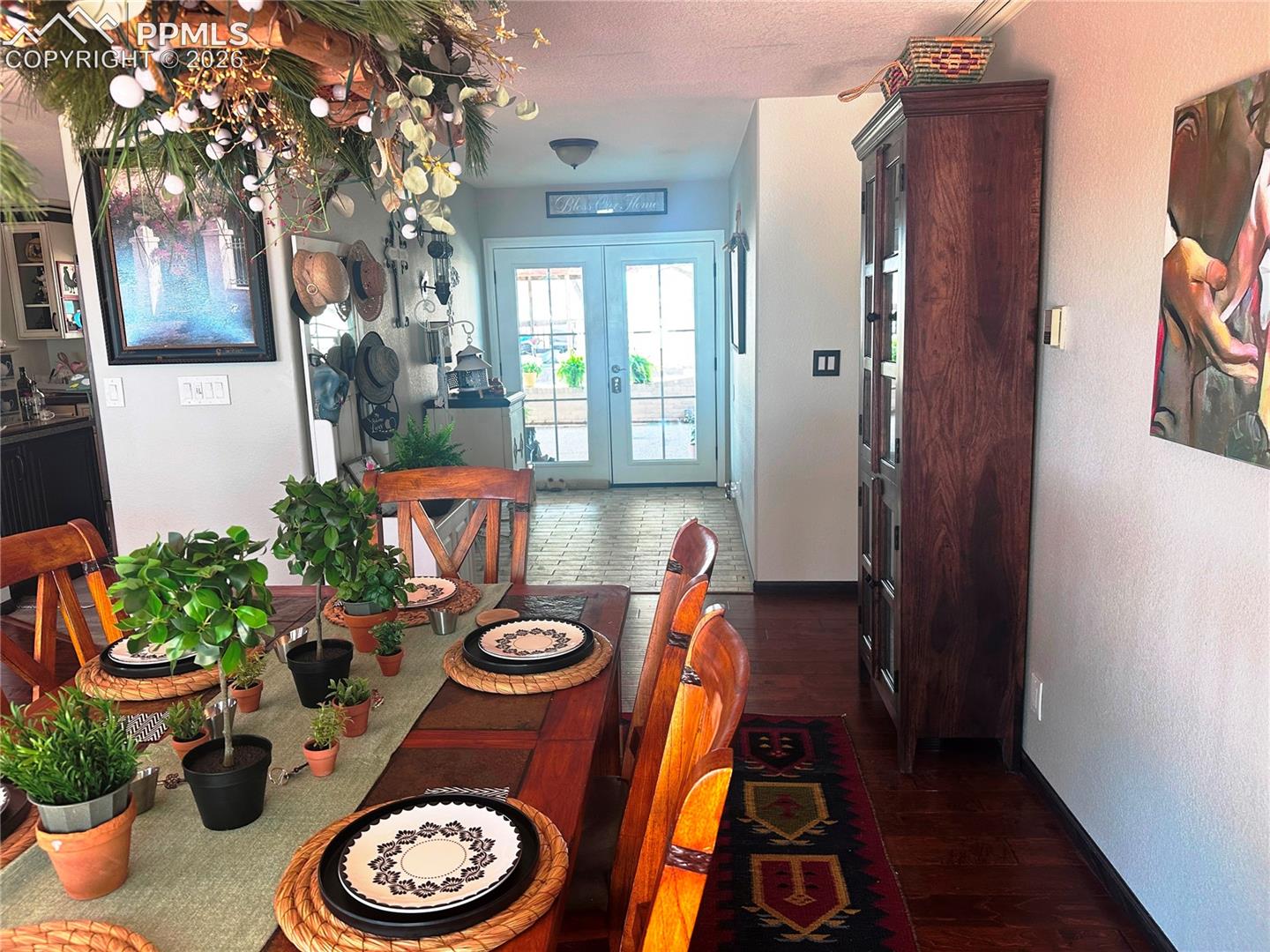 Dining room showing tiled entry foyer.
