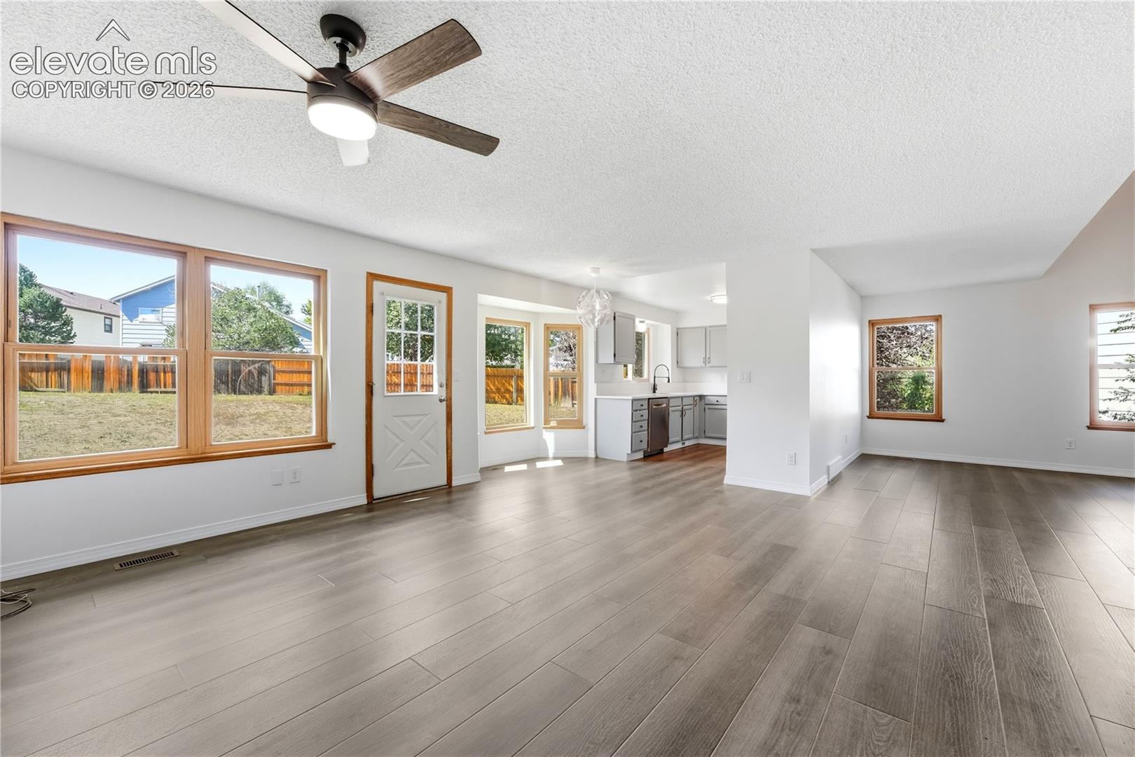 Dining area with new LVP flooring, and additional living room or family room